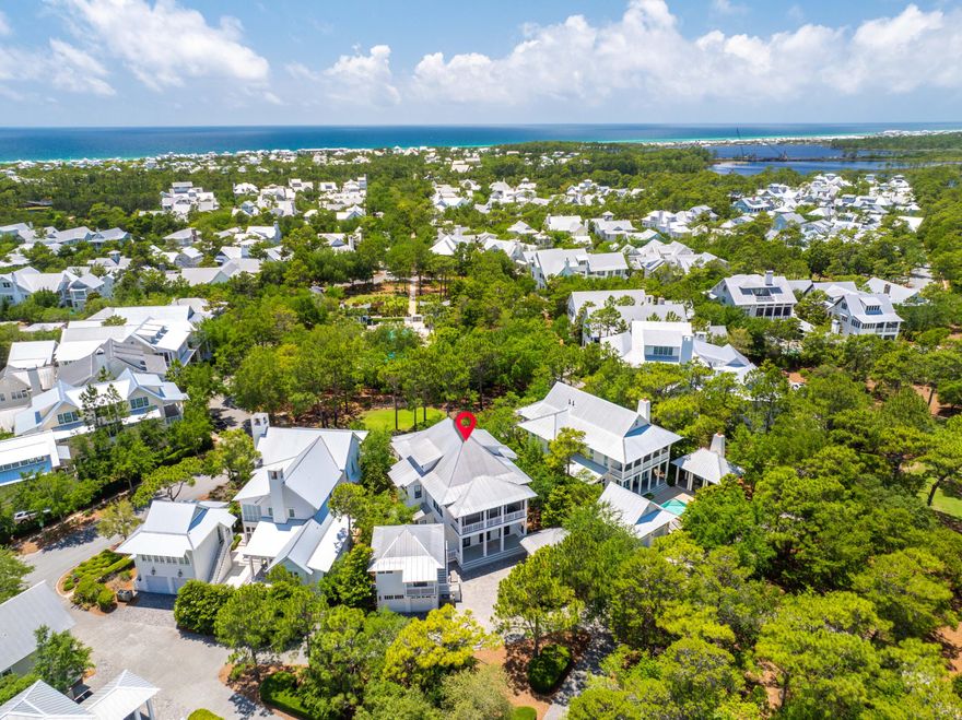 Set on Sand Hill Circle, WaterColor's highest point and most prestigious street, stands this private coastal retreat offering the ultimate blend of luxury, comfort, and location. Just steps from the serene Frog Pool and a short walk to both the Beach Club and Camp WaterColor, this exceptional property includes a beautifully designed main home, carriage house, and oversized two car garage and is being sold fully furnished for a truly turnkey experience. Every inch of this home reflects impeccable craftsmanship and attention to detail. Never rented and meticulously maintained, it features exquisite oak floors, 12' ceilings, elegant crown molding, custom marble flooring and countertops, tailor-made blinds, and three sets of French doors in the front and back that flood the interiors with natural light.
 
At the heart of the home is a gourmet kitchen designed for functionality and entertaining, featuring an expansive center island, breakfast bar, Wolf oven, cooktop, warming drawer/microwave, along with a Sub-Zero refrigerator, wine fridge, two freezer drawers, icemaker, Miele dishwasher, two sinks, and an abundance of custom cabinetry. Two spacious pantries provide additional storage, while thoughtful extras like a formal sitting room, open-concept dining and living area with a cozy gas fireplace, a dedicated office, convenient sand room with built-ins, a stylish powder bath, and a generously appointed laundry room with a marble folding table, raised washer and dryer, and built-in ironing board complete the first level.
 
Upstairs, three beautifully appointed oversize bedrooms await, each offering the privacy and convenience of an en-suite bath. Accessible by the staircase or private elevator, the upper level also features a charming bunk room with its own private bath, making it an ideal space for younger guests or additional visitors. A thoughtfully placed coffee bar with a beverage fridge adds an extra layer of comfort and convenience to the upstairs living experience.
 
The detached carriage house above the two-car garage offers guests both privacy and comfort, featuring a cozy living area with pull-out sofa, a well-appointed kitchenette, and a spacious bedroom with an en-suite bath. Just below, an outdoor shower adds a convenient touch, perfect for rinsing off after a day at the beach.
 
Outdoors, an expansive pavilion is perfectly equipped for outdoor living, featuring a built-in refrigerator, grill, sink, granite countertops, and a cozy fire pit for year-round enjoyment.

As a bonus, the property includes DRB-approved plans for a private pool, an additional one-and-a-half-car garage, and a spacious flex room above offering the opportunity to expand your living and entertaining space.
 
This one-of-a-kind residence is custom throughout and truly a must see for those seeking elevated coastal living in one of 30A's most beloved communities. Call today for more details or to schedule a private showing.
