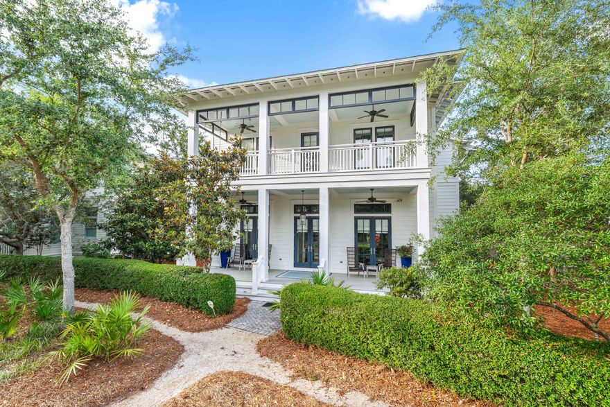 Set on Sand Hill Circle, WaterColor's highest point and most prestigious street, stands this private coastal retreat offering the ultimate blend of luxury, comfort, and location. Just steps from the serene Frog Pool and a short walk to both the Beach Club and Camp WaterColor, this exceptional property includes a beautifully designed main home, carriage house, and oversized two car garage and is being sold fully furnished for a truly turnkey experience. Every inch of this home reflects impeccable craftsmanship and attention to detail. Never rented and meticulously maintained, it features exquisite oak floors, 12' ceilings, elegant crown molding, custom marble flooring and countertops, tailor-made blinds, and three sets of French doors in the front and back that flood the interiors with natural light.
 
At the heart of the home is a gourmet kitchen designed for functionality and entertaining, featuring an expansive center island, breakfast bar, Wolf oven, cooktop, warming drawer/microwave, along with a Sub-Zero refrigerator, wine fridge, two freezer drawers, icemaker, Miele dishwasher, two sinks, and an abundance of custom cabinetry. Two spacious pantries provide additional storage, while thoughtful extras like a formal sitting room, open-concept dining and living area with a cozy gas fireplace, a dedicated office, convenient sand room with built-ins, a stylish powder bath, and a generously appointed laundry room with a marble folding table, raised washer and dryer, and built-in ironing board complete the first level.
 
Upstairs, three beautifully appointed oversize bedrooms await, each offering the privacy and convenience of an en-suite bath. Accessible by the staircase or private elevator, the upper level also features a charming bunk room with its own private bath, making it an ideal space for younger guests or additional visitors. A thoughtfully placed coffee bar with a beverage fridge adds an extra layer of comfort and convenience to the upstairs living experience.
 
The detached carriage house above the two-car garage offers guests both privacy and comfort, featuring a cozy living area with pull-out sofa, a well-appointed kitchenette, and a spacious bedroom with an en-suite bath. Just below, an outdoor shower adds a convenient touch, perfect for rinsing off after a day at the beach.
 
Outdoors, an expansive pavilion is perfectly equipped for outdoor living, featuring a built-in refrigerator, grill, sink, granite countertops, and a cozy fire pit for year-round enjoyment.

As a bonus, the property includes DRB-approved plans for a private pool, an additional one-and-a-half-car garage, and a spacious flex room above offering the opportunity to expand your living and entertaining space.
 
This one-of-a-kind residence is custom throughout and truly a must see for those seeking elevated coastal living in one of 30A's most beloved communities. Call today for more details or to schedule a private showing.
