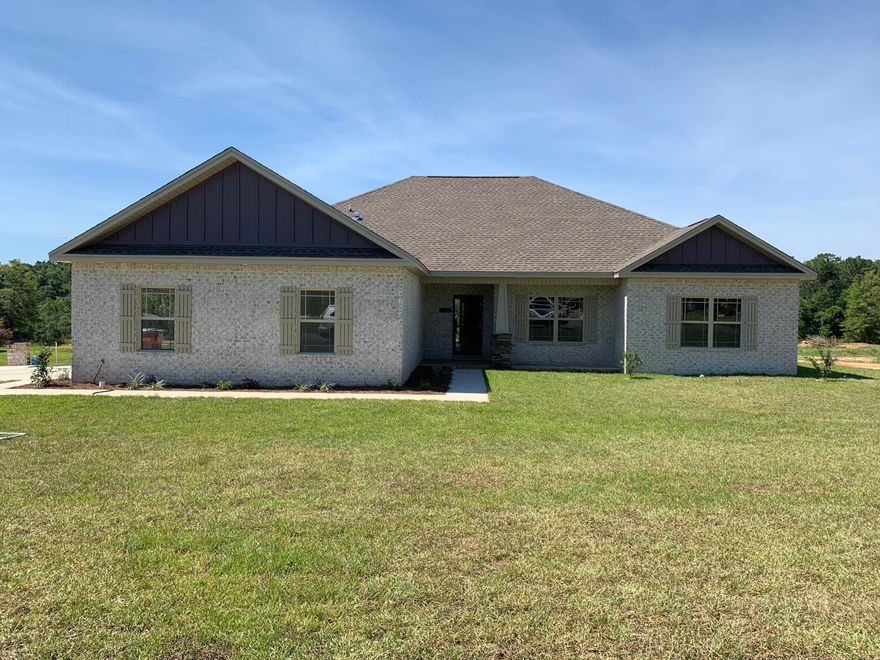 Under Constrution- Beautiful new construction home in Baker. This custom built home is not your everyday cookie-cutter design. Enjoy the amazing covered front and back porches. The home features high ceilings and attention to detail, trey ceilings in living room and master bedroom. Stone fireplace. All counter tops are granite, custom cabinets in baths and kitchen. Breakfast bar overlooking open floor plan and separate office. High end finishes. Recessed lighting and upgrades fixtures throughout. All lots are half acre +, enjoy the quiet atmosphere of the country without the drive! PHOTOS are of similar build, colors will vary. Est completion June 2019