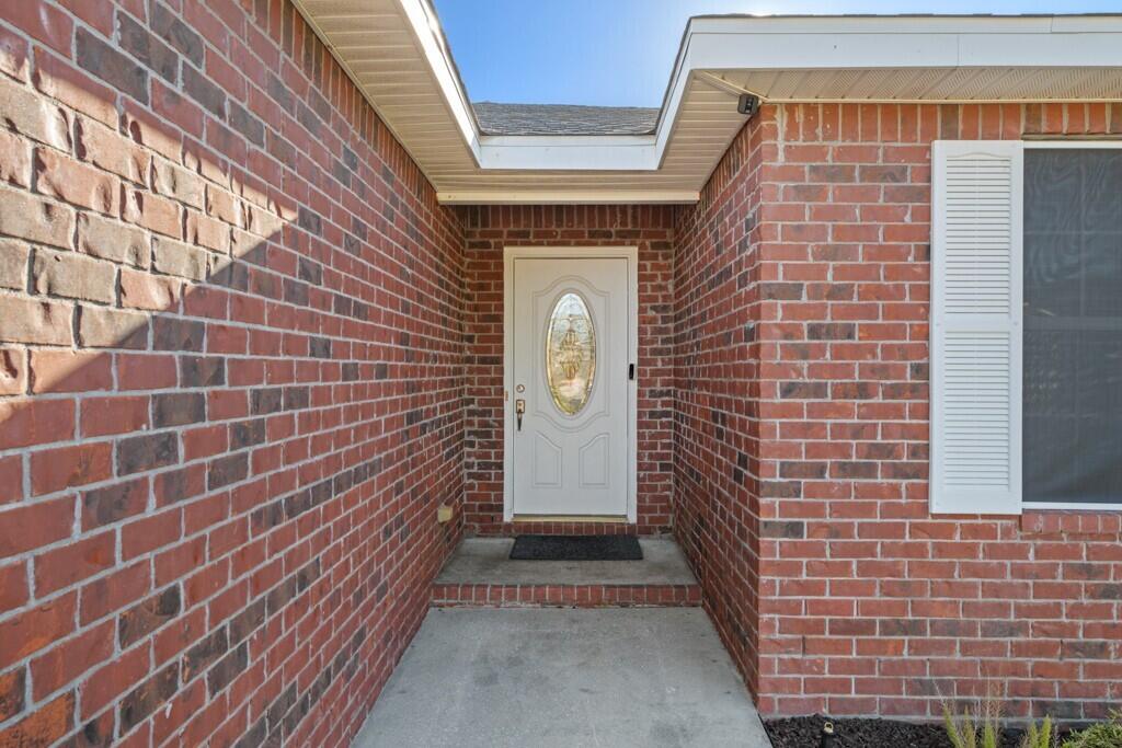 Welcome to this 3 bedroom, 2 bathroom, brick home with a 2 car garage in Navarre - located less than 3 miles to Navarre Beach, and just 11 miles to Hurlburt Field! Situated on a 0.371 acre lot with NO HOA and a privacy fenced in backyard! This move-in-ready, split floor plan home is perfect for anyone looking to live in Navarre, or looking to purchase their next rental property. With fresh paint throughout, newer roof and water heater, and LVP and tiled flooring throughout the common areas. Through the foyer, you enter the living space with vaulted ceiling and updated ceiling fan. Just off the right side of the living room are the 2 spare bedrooms and updated full bathroom with granite topped vanity. The primary bedroom with ensuite features an updated tiled shower/tub combo, walk-in closet with organization system, and updated vanity with granite countertop. The kitchen has refreshed cabinets, updated light fixtures, and stainless steel appliances. Just off the kitchen is the dining area that has a door leading to the brick paver patio in the large backyard. Schedule your showing today and make this your new HOME!