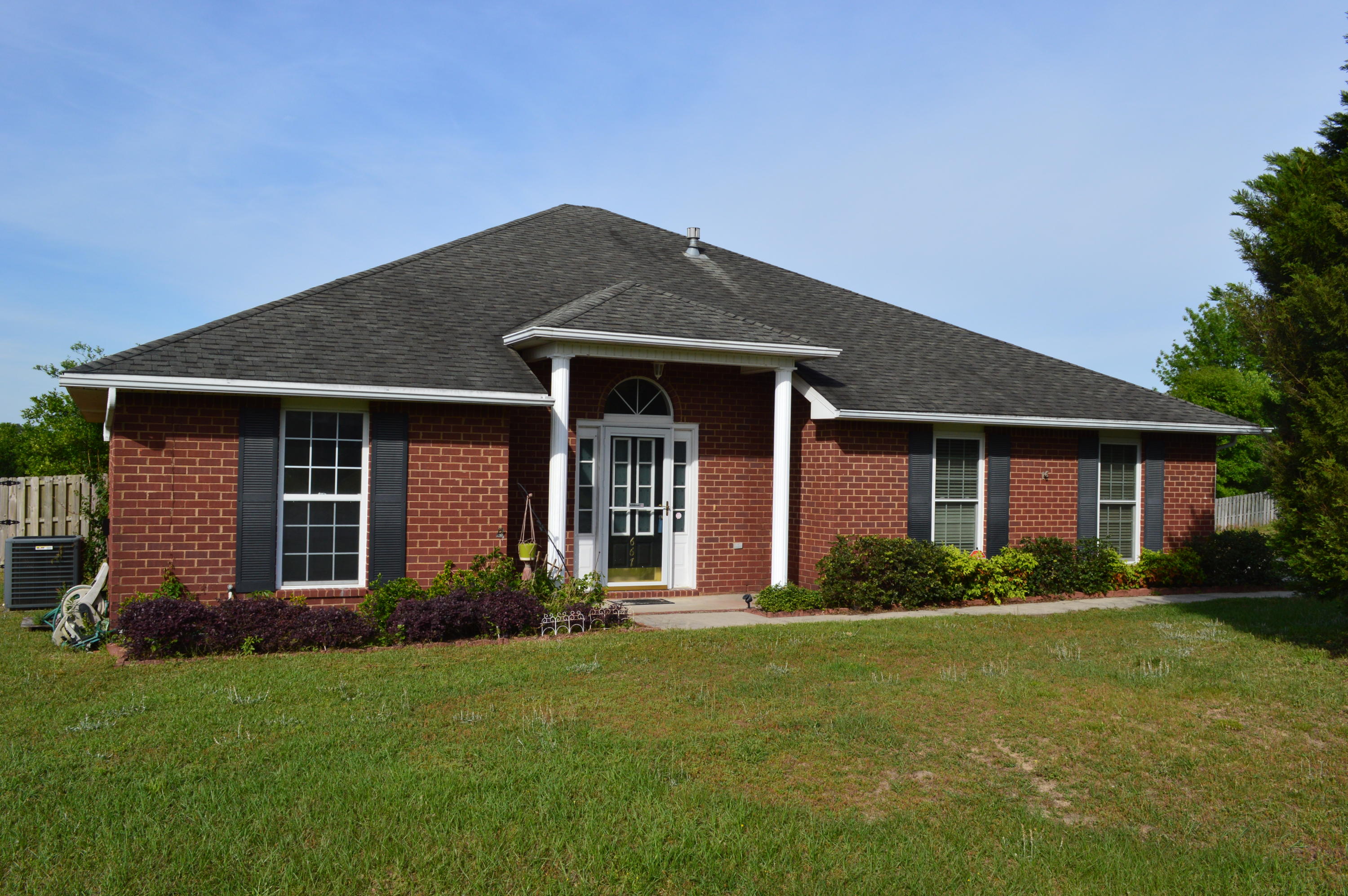 Great south Crestview 4 bedroom and 2 bath brick home on over a 1/3 acre corner lot in Antioch Estates! Located off of PJ Adams for an easy commute to the bases or the beach. Split bedroom design built by Centennial Development featuring tile in all of the wet areas. Roomy master bedroom and bath with dual vanities, garden tub and separate shower. Large living room with a great fireplace is open to the kitchen which features stainless steel appliances and a gas range. Screened Florida room is the perfect place for morning coffee or evening tea and offers great views of west Crestview. Privacy fenced back yard. Make your appointment today to see this south Crestview gem!