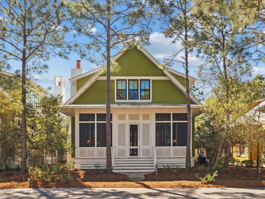 Radiating style and creativity at every turn, this one-of-a-kind WaterColor home is a bold yet balanced expression of modern coastal living. The exterior makes a memorable first impression with its striking green facade, black-framed windows, and expansive screened porch--an inviting space that sets the tone for the design-forward interiors that follow. Inside, the home unfolds into a series of well-curated spaces filled with texture, light, and thoughtful detail. The living room is grounded by natural elements like woven furnishings, wide-plank hardwood floors, and soft neutral tones, while layers of pattern and shape add sophisticationfrom the tailored drapery framing the tall windows to the oversized pendant light floating above a clean-lined fireplace. Every room feels intentional and refined, blending laid-back beach house energy with elevated, high-design sensibility. The first floor features soaring 12' ceilings and brand-new shiplap siding, adding both depth and character to the living space.

The kitchen is nothing short of exceptional, with a dramatic waterfall marble island, deep navy cabinetry, and graphic tile backsplash adding depth and drama. Eye-catching rattan pendants and integrated open shelving balance the space with natural warmth. Open to the main living area and adjacent to a dedicated dining space, the flow is seamless and built for entertaining.

Upstairs and down, the bedrooms are designed as serene escapes. The primary suite features natural woven blinds and a minimalist palette grounded in texture. The bunk room is a work of craftsmanship, with six custom built-in beds, reading sconces, and hidden storage, making it as practical as it is charming. Each bathroom feels like a design feature of its ownespecially the stunning main bath with floor-to-ceiling patterned tile, dual vanities with marble countertops, brass fixtures, bamboo-framed mirrors, and a sculptural soaking tub set beneath a trio of picture windows and a statement shell chandelier. A walk-in shower with marble bench and hex tile completes the spa-like setting.

This home is also built for comfort and efficiency, with full foam insulation throughout, making it exceptionally energy efficienta thoughtful detail that enhances both livability and long-term value.

Outdoors, the screened dining porch is nestled among tall pines, offering a private, treehouse-like experience for meals, morning coffee, or quiet evenings under the stars.

Situated in WaterColor's sought-after Camp District, the home is perfectly positioned to enjoy everything the community offersnine resort-style pools, tennis and pickleball courts, trails and pocket parks, and Camp WaterColor's lazy river and splash pad. Residents also have access to the private WaterColor Beach Club and the serene boathouse on Western Lake for paddleboarding and kayaking.

Curated with intention and designed to delight, this home is a standout offering for anyone drawn to artistry, nature, and the elevated lifestyle that only WaterColor can provide.