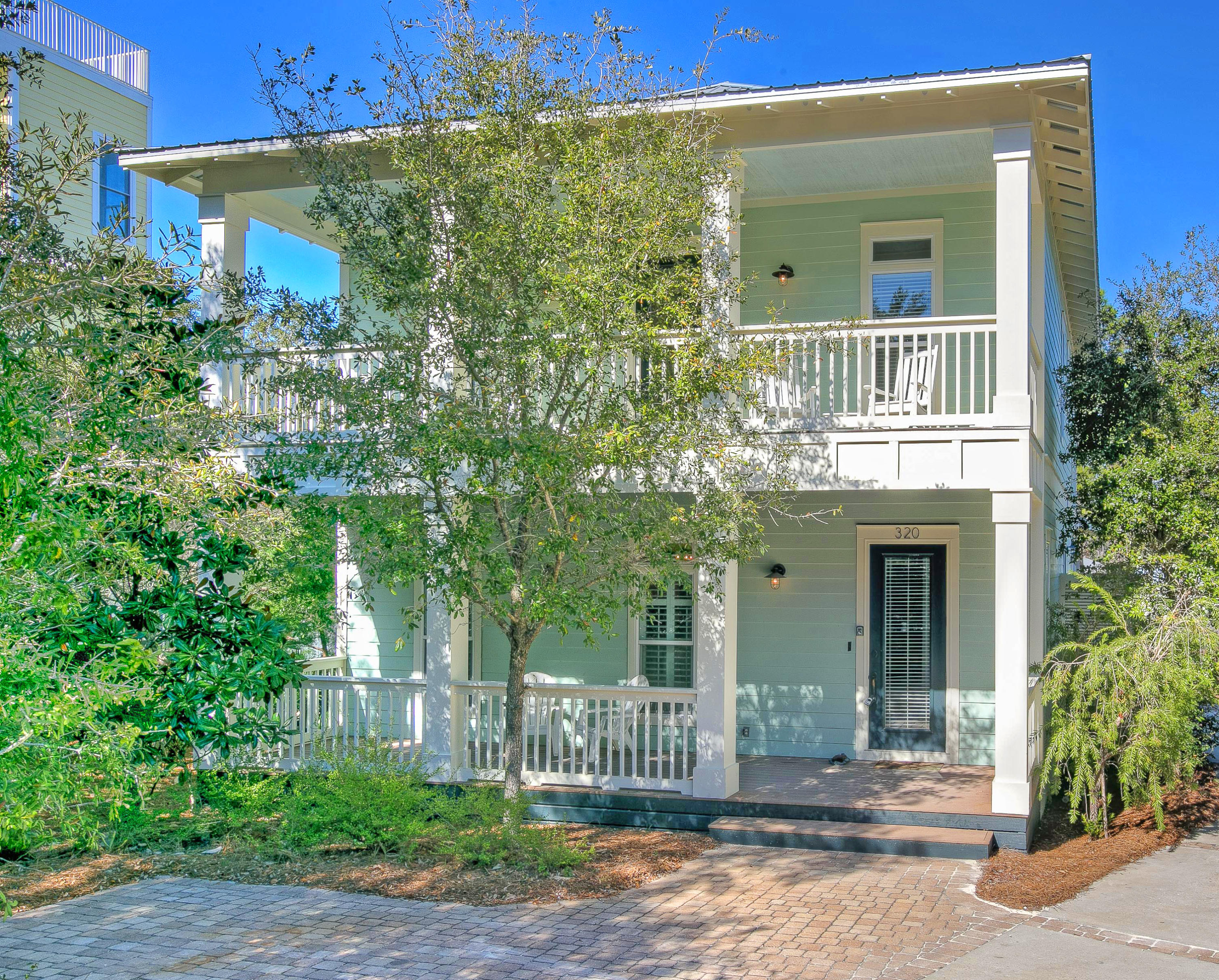 This lovely home has it all. Top quality construction and location. Built by Mark Bakane, it is tucked away in Old Seagrove Beach on an oak-canopied road adjacent to Seaside and just 2 blocks to the beach along with everything 30A has to offer: World class restaurants, unique shops, outdoor concerts, farmers markets, theater, art festivals and galleries, and of course the sugar white beaches of South Walton. This home sleeps up to 12 people and is a vacation rental with a good solid income. Enjoy the private heated pool surrounded by a brick paver pool deck with lots of tables and loungers located in a very private fenced back yard. There is a gracious front porch greeting you into the main living area, which is wide open with 12 foot ceilings, lots of tall windows, beautiful hard wood