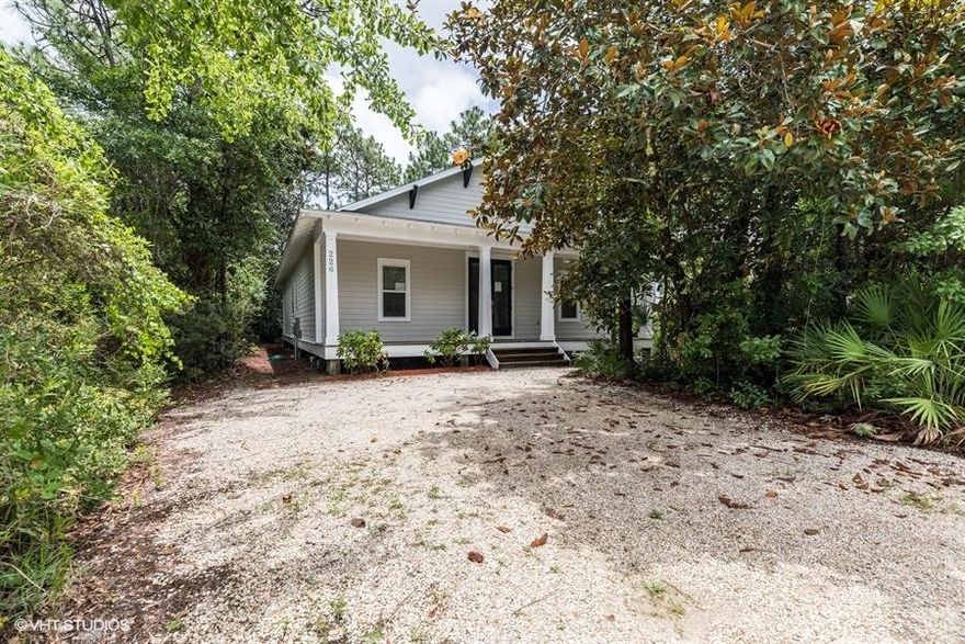 Cute, well built and environmentally friendly! This cottage home is situated near Charles E. Cessna Park, which has Bay access and boat launches open to the public. The home has both front and back covered porches the entire width of the house. The setting is serene and private, blending into the indigenous natural landscape, creating an ambience of tranquility. One large great room encompasses living room, dining room and kitchen-exceptional for entertaining. The master bedroom is spacious with master bath on suite that includes a dual vanity and walk in closet. The laundry room has plenty of space for folding and storage. The home has been freshly painted inside and out and new carpet installed in the bedrooms. The main area has bamboo wood floors, bathroom floors have new large, neutral