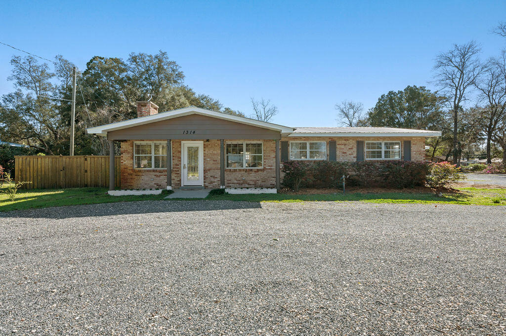 Charming Hobbyist Haven Home with In-Ground Pool & Room for All Your Toys!This spacious home sits on 1.02 acres, offering plenty of boat and RV storage! The beautiful in-ground pool and covered back patio make it the perfect spot for entertaining or simply unwinding in your own private oasis.Inside, you'll discover fresh new flooring, stylish trim, and a beautifully updated kitchen with newer appliances, granite counters, large island and wonderful vinyl flooring. The stunning retro hall bathroom, with its custom tile flooring, adds a unique touch of character, while the oversized master bath has been thoughtfully refreshed for modern comfort with two vanities, huge walk-in shower and ample natural lighting. The very spacious master bedroom is a true retreat, featuring a walk-in closet and convenient access to the backyard, side yard, and garage. For added comfort, an additional mini-split system allows you to keep the room extra cool perfect for those who love a crisp, refreshing sleep environment.

This expansive 1.02-acre lot offers plenty of space to enjoy the outdoors! A dedicated garden area with raised beds is perfect for growing fresh vegetables, herbs, or flowers, while the fully fenced-in yard provides privacy and security. Whether you want to cultivate your backyard oasis or need extra room for pets and play, this property delivers the ideal blend of open space and functionality.

For the DIY enthusiast, there are 2 workshops, both with electricity, providing endless possibilities for projects and hobbies. The newer, more extensive workshop is 30x30x18! The circular gravel driveway and additional side driveway offer parking when entertaining. There is also a carport and extra space to add even more toys!

Vinyl Liner 2025
HVAC 2024 (4 Ton)
Water Heater 2025
Roof 2019
Termite Bond in place
