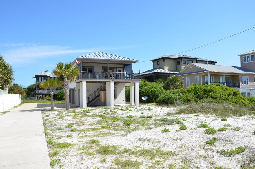 Live in your furnished, top-of-the-line carriage house (MLS #728365) while building the home of your dreams on this 188'x60' lot. The value is in the lot which is located in a highly desirable waterfront community. Snowdrift Beach has a private road with its own beach crosswalk. The owner's concept would be to design a 3 story house quarter turned to the SW on the lot to encompass the perpetual view of the Gulf of Mexico and to add a garage, pool, and courtyard to serve both dwellings. The set backs are 20' front, 5' sides, and 15' rear. There are no HOA fees. Voluntary dues of $100 have been paid by seller annually. The concrete construction of the guesthouse receives very favorable insurance rates compared to wooden houses on the beach.Refer to supplement for additional information.