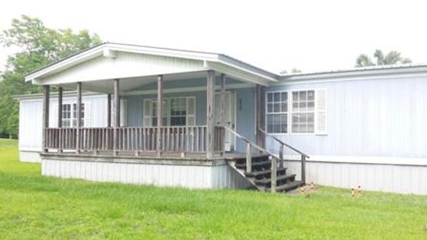 Room to Roam! Three bedroom three full bathroom home on 3 acres in Laurel Hill! This home features gas fireplace in living room, eat-in kitchen and two bonus rooms. One could possibly be a fifth bedroom or home office or craft room. Large exterior storage building that is 32x48 that is equipped with a kitchen and bathroom. Additional covered workshop that is 24x44.