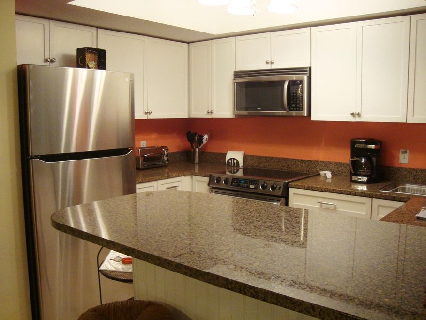 This condo has been meticulously updated and the only other thing it needs is a buyers signature on the dotted line! Great location in complex with pool outside your back door, a short walk to the tennis courts OR beach. First floor one story unit means no steps, so bring Grannie. New cabinets throughout with granite. Tile throughout. Updated lighting and furnishings.Newer appliances and recent upgraded HVAC. Twin beds are both trundles so the room sleeps four. Master suite is large with King bed plus a day bed. Master bath updated with a HUGE walk in shower. Fabulous screen porch walks out to lush landscaped grounds. Locked outside storage at front door.Selling furnished with a few pieces of art not transferring with sale.