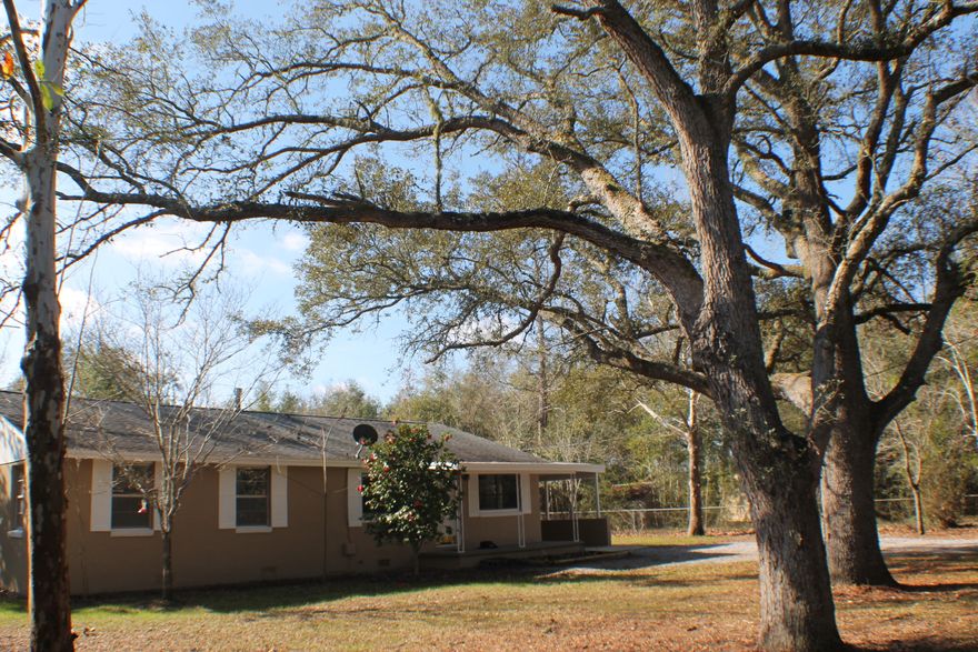 Home Sweet Home 2.46 Acres with Massive live Oaks for shade and some clear area for that dream barn or a Garden! What else could you dream of? Location quick drive to Middle and Elementary schools, hospital and Shopping! Home sweet Home 3152 E. Chestnut! Dimensional shingle roof 3 bedroom 1.5 bath an office area huge laundry and lots of storage! Don't forget the Covered back porch , Outside storage room, and the huge carport! The yard is chainlink fenced and cross fenced! The well could make great irrigation but its on City water! (Note County location and cheaper county taxes with the convenience of city water.) There is a lawn mower shed and a barn!