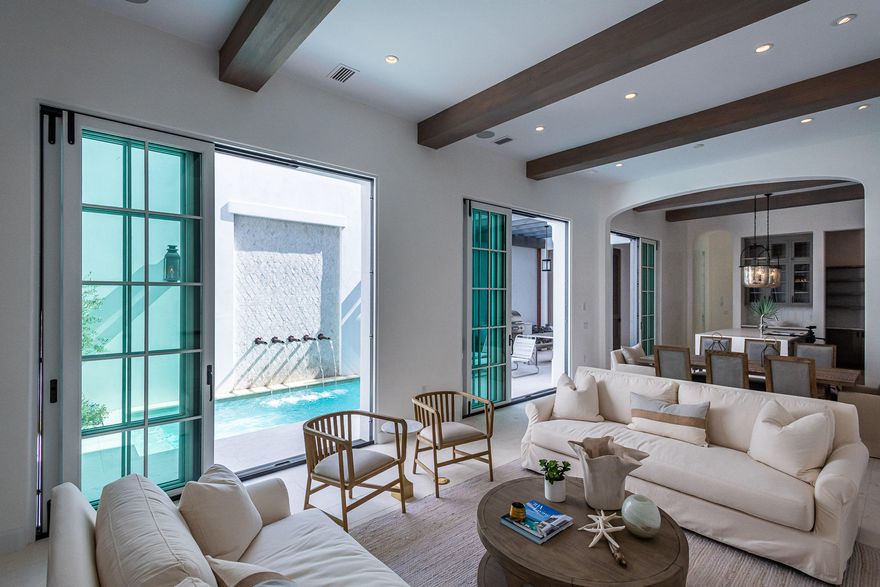 Domin Bock Architecture checked all boxes in the design of 29 S. Charles. Expansive living, generous bedrooms & closets with multiple indoor & outdoor entertaining areas create a soulful environment. Gulf of Mexico views can be taken in from the 2nd level balcony and more so from the 3rd level roof terrace with its own fireplace & conditioned bar & powder room.Entering at the 1st floor you immediately are captivated by the openness and flow of natural light found in 29 S. Charles having open living, dining, and gourmet kitchen which encapsulates the courtyard with pool & outdoor dining with summer kitchen. Open the 3 sets of slider doors and your outdoor living is fully connected with indoor living.Ceiling beams define the 1st level spaces mirrored with exquisite