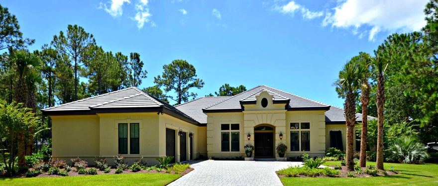 Beautiful and immaculate home with open floor plan and high ceilings situated on quiet cul-de-sac in Island Green overlooking pond. Many custom upgrades include tumbled stone travertine throughout (no carpet), gas fireplace in living area with custom built-ins, 11' island in kitchen, gas cooktop, icemaker, quartz countertops, oversized walk-in shower & separate jetted tub in Master Bath, 2 walk-in closets in Master Suite. Fabulous outdoor space with gas fireplace and outdoor kitchen. Saltwater pool with spitters. 2-Car Garage + Golf Cart Space