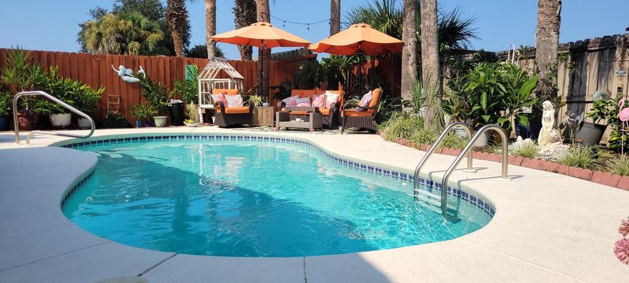 Panama City Beach PARADISE!  Located in the highly desirable west end of PCB, this cottage has it all!  *2 LIVING AREAS*3 BEDROOMS & 2 FULL BATHS*IN-GROUND POOL*STORAGE SHED*BEAUTIFUL LANDSCAPING*CARPORT*NO HOA & STR ALLOWED*WALKING DISTANCE TO SUGAR SAND BEACH*CLOSE TO PIER PARK, TOP GOLF, 30A AND DOG BEACH