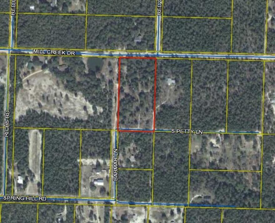 Nicely Treed 5 acre parcel. Water and Power access on the west side of the property line.  Tap fee has been paid.