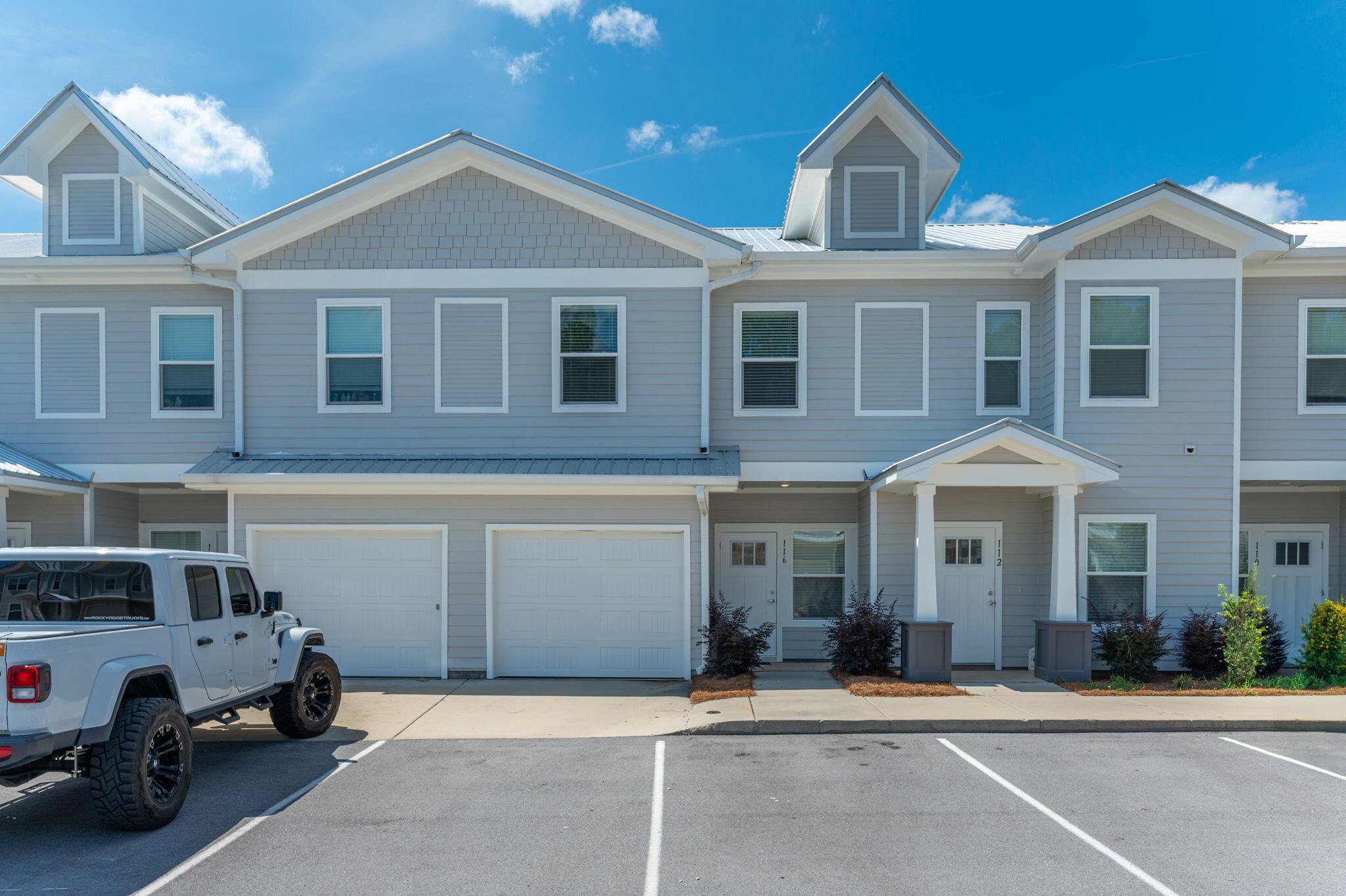 One of the most sought after 3/2.5 Garage-unit is now available! This Savannah Floorplan comes fully upgraded with LVP flooring in all the bedrooms (no Carpet) and Screened in Back Porch for Bug Free Chill time. A Custom Glass Panel is also installed in the Master Walk-in Tiled Shower for Splash-free showers. This cute little community comes with a common pool, recently installed pickleball court and play area (with swings!). There is also a weekly Food Truck on rotation for ''No Cook Thursday''! Each unit come with their own assigned parking, leaving unnumbered lot open for anyone to use in a reasonable manner. Compared to the other Vista (1336sqft) and Horizon (1521sqft), this Savannah unit offers more: foyer closet, upstairs storages, screened-in back porch and a utilitarian garage!