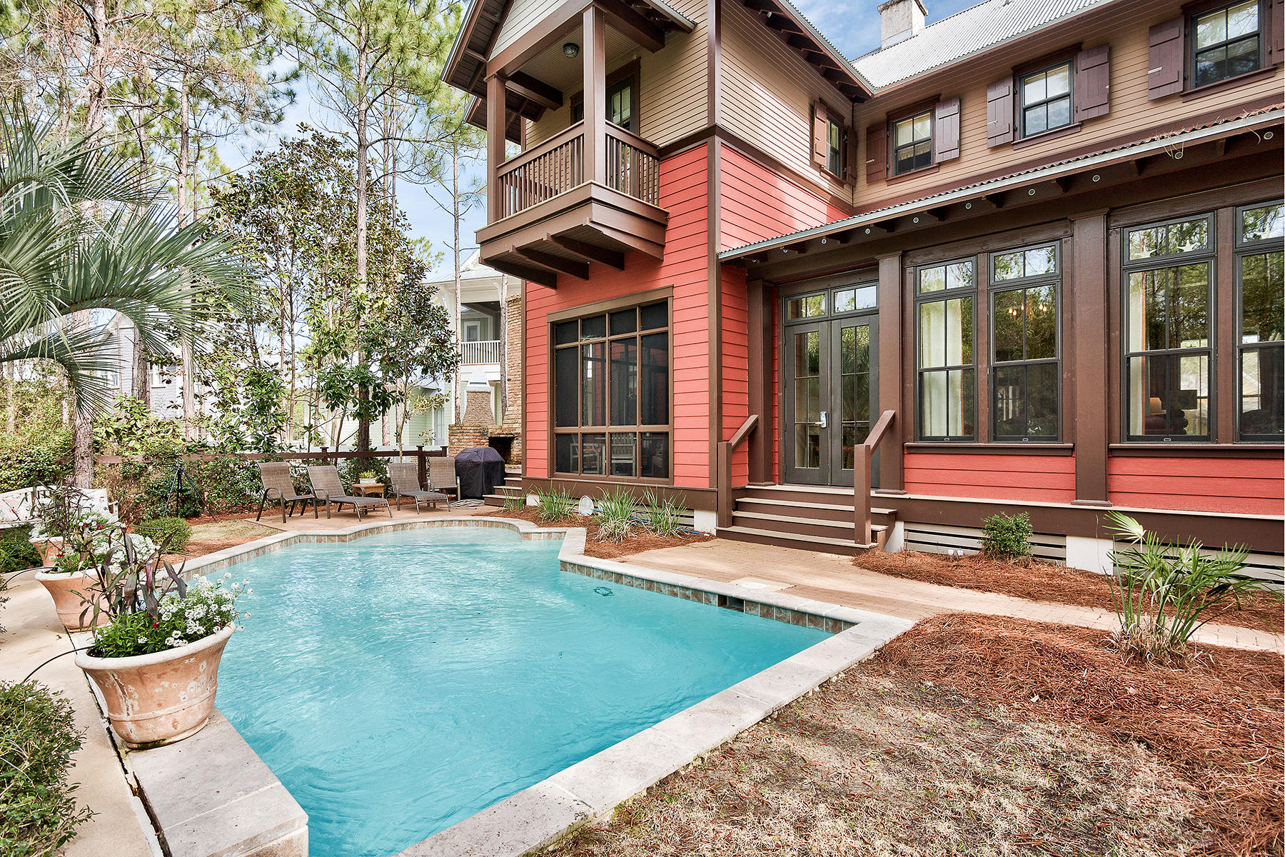 Exemplary coastal escape retreat in sought after WaterColor sits on a generous quarter acre lot yet just blocks from beaches. This 4 bedroom, 4.5 bath retreat boasts a tranquil backyard oasis with private pool and borders woodland conservation area allowing you to commune with nature year round. With curb appeal galore, including a spacious front porch that reminds you of yesteryear, this home has all top amenities. The living and dining areas are united by rich wood floors, white wood ceiling and pivot around a stunning two sided tabby stone fireplace. The beautifully detailed chef's kitchen features a Viking vent hood which descends from the ceiling above kitchen island with six burner commercial grade gas range, custom cabinetry and stainless steel appliances.