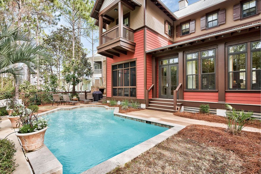 Exemplary coastal escape retreat in sought after WaterColor sits on a generous quarter acre lot yet just blocks from beaches. This 4 bedroom, 4.5 bath retreat boasts a tranquil backyard oasis with private pool and borders woodland conservation area allowing you to commune with nature year round. With curb appeal galore, including a spacious front porch that reminds you of yesteryear, this home has all top amenities. The living and dining areas are united by rich wood floors, white wood ceiling and pivot around a stunning two sided tabby stone fireplace. The beautifully detailed chef's kitchen features a Viking vent hood which descends from the ceiling above kitchen island with six burner commercial grade gas range, custom cabinetry and stainless steel appliances.