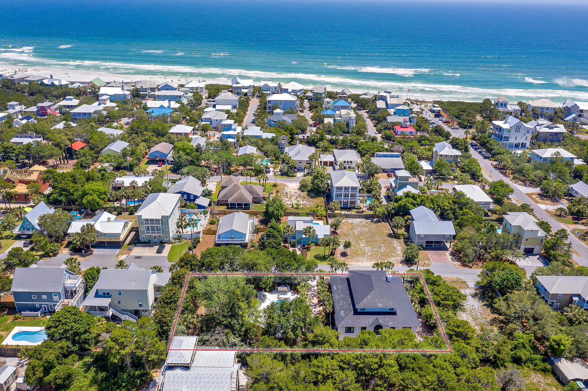 This is a one of a kind luxury vacation property on the West end of 30A with endless opportunities. Gross rentals over $150k in 2019. The large home is positioned on a three lot parcel of land. This 8 bedroom, 8 bath home, features 2 massive open living areas, allowing plenty of space for entertaining large groups. The home can sleep up to 29 people. Relax in the natural setting while enjoying the enormous outdoor living areas on one of two screen porches. The large saltwater pool and outdoor cooking area with wet bar will make it tough to leave. The home is just steps from the beautiful Gulfview Heights beach access. AND the top floor has views of the water!Gulf Place is a bike ride away and offers restaurants, shopping, wine, art and music festivals throughout the year.