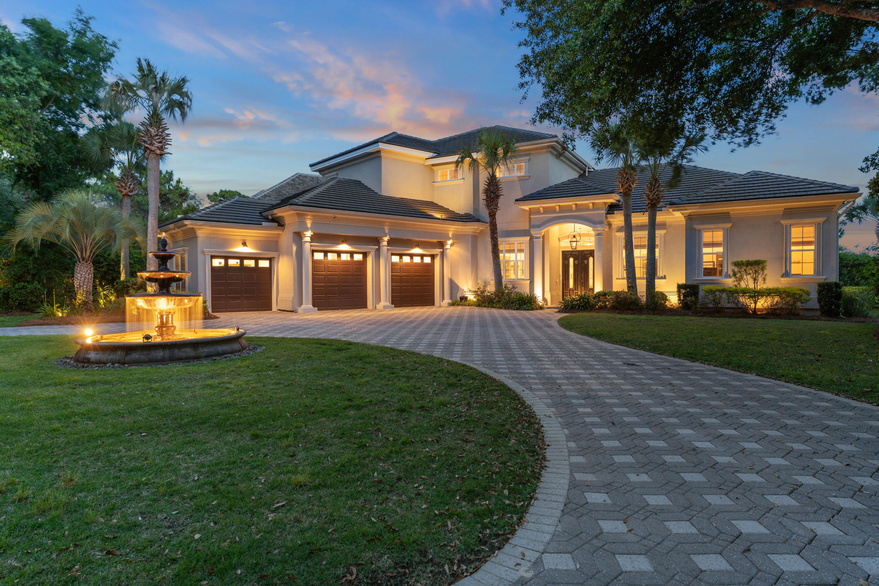 Welcome to luxury Destin living at its best! 515 Regatta Bay Blvd is a stunning golf course home overlooking the 15th and 16th holes and lakes in the sought after gated-community of Regatta Bay, one of Destin's premier golf communities that has been named a Golf Digest's Top Places to Play in North America. You will hear the tranquil sounds of the stately fountain as you step through the front doors into the bright, airy, open concept first floor which features 12-13 foot ceilings throughout, crown molding, smart Lutron Caseta lighting and tray ceilings in the living room and primary suite. The custom gourmet kitchen is made for entertaining and is equipped with a Wolf seven burner gas stove, Bosch dishwasher, and a Sub-Zero refrigerator, along with a Scotsman ice maker. There is ample counter space and cabinets with a large custom pantry area and laundry room, both conveniently located off the kitchen. The large laundry room was recently fully updated with new cabinetry and quartz countertops. The kitchen opens to the spacious living area, which features a gas fireplace and overlooks the pool, lanai, and the golf course. The downstairs primary suite includes his and her walk-in closets and adjoins the master bath and a flex space, currently used as a workout room. An office, also currently used as a child's playroom, is located off the living area. The second level hosts 3 bedrooms and 2 baths and provides access to the second-floor screened-in sitting area with impressive views of the lake and golf course. The current owners have paid close attention to detail, making many upgrades and improvements to the home. Enjoy the peace of mind that comes from a new whole-home 32kW Generac generator (installed in 2021). Additional improvements include: two new air conditioners and air handlers (upstairs and downstairs), pool replastering with decorative tile, screening-in the 2nd-floor balcony, custom luxury pantry, newly renovated laundry room, and LVP flooring. The curb appeal is exquisite with lush landscaping, a custom lighted outdoor fountain, and a circular paver driveway. The large garage accommodates two full-size parking spaces and a golf cart parking space. The current owners are also offering several items that may convey with the home if desired by the buyer, including all TVs ( including an 85"Sony, a 75" Samsung Frame TV and outdoor TVs), a 10-foot custom wood dining table with 8 Restoration Hardware chairs, Restoration Hardware bar stools, Restoration Hardware master bedroom furniture set and a 2022 Electric ICON six-seat golf cart, and much more. A complete list of these items is available for review, as is an owner list of improvements. 515 Regatta Bay Blvd is more than just a home, it is a lifestyle facilitated by the many amenities Regatta Bay has to offer. In addition to the top rated golf course, residents of Regatta Bay enjoy the community pool, kids pool, tennis and pickleball courts, playground and clubhouse. Take your golf cart to the clubhouse for dinner, to the beach for a relaxing day or a short drive to the shops and restaurants of Destin Commons. This is truly a home not to be missed. Buyer to verify all dimensions.