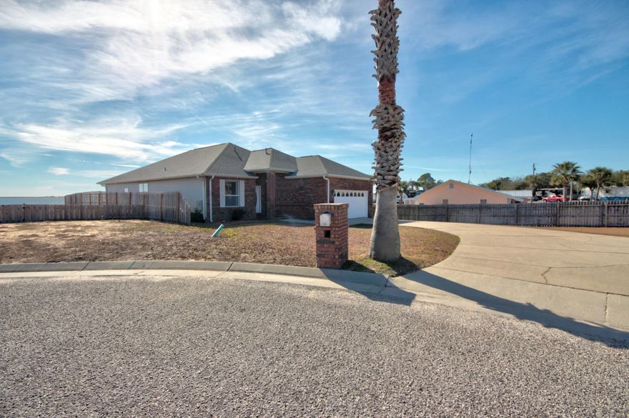 Accepting BACK UP OFFERS. Beautiful waterfront home with unobstructed views of the Intracoastal Waterway does not come along often...not at this price! Schedule your showing today to view this amazing piece of waterfront property just east of Navarre Beach bridge. Beautiful 3 bed / 2 bath red brick home, open and airy, lots of natural light, spacious living areas and kitchen. Large master bedroom and bathroom. You'll have access to a beautiful deck overlooking the water through the living room, dining room and master bedroom. Incredible entertainment space! New luxury vinyl plank flooring installed throughout the house. You'll have great extras, like the mud room just off of the garage and the large utility room. New HVAC within the last year!