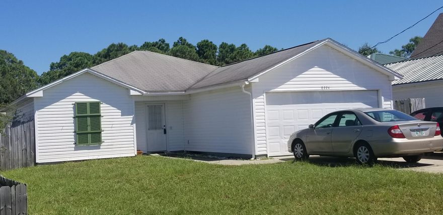 Unique opportunity to own a home within blocks in Panama city beach! This 3 bedroom, 2 baths home offers a large eat in kitchen with a free season room two steps away. The master suite has an exceptionally large bedroom, spacious walking closet, with accommodating full bathroom. The master suite offers privacy from two additional bedrooms on apposing side of the house. A full bath services both bedrooms and its located steps from the living room. 2 car garage makes it easy to unload groceries to the kitchen. Laundry room is located centrally in the home. This home has it all for a family looking to be in a heart of Panama City Beach without breaking the bank.