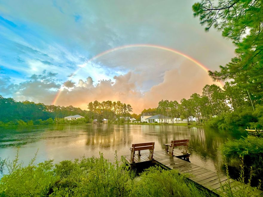 Rare Opportunity to own a unique property situated on lake Alicia in Santa Rosa Beach Florida! Great location 2 miles from the Gulf beach access and 2 miles from bay boat access. This is Essentially two homes on an approximately 3/4 acre lot. One carriage house consisting of 2 apartments- A one bedroom apartment (1 bedroom 1 bathroom) with private entrance and a studio apartment, also a 1 bedroom one bathroom with a two car garage with skylights and private entrance. The main residence, 3 bedrooms 2 bathrooms also has private entrance and plenty of parking, tons of natural light, east/west oriented with lake views throughout.  Large outdoor covered porch complete with hot tub. All three separate living areas have been completely renovated, 3 kitchens and 3 laundry areas. Update: New $30,000 driveway with extra pad for boat/RV parking, plus a new 5 person hot tub have just been added to the home! 

All on one level, no HOA, and not in a floodplain(zone x). The lot is something to see to appreciate. Beautifully landscaped with mature trees, gardens, well groomed and irrigated. There is even a small pond with a fountain. A dock nestled along lake Alicia, complete with a powered shed and 4 vegetable gardens. Relax in the Hot tub on the 420 Sq.ft covered screened in patio, included in the sale. The newly built 2 car garage is equipped for an electric vehicle. All units have their own private fenced in area. New floors, new paint, new solid quartz countertops and backsplash, new appliances, custom built on-site cabinets. This property has it all! 