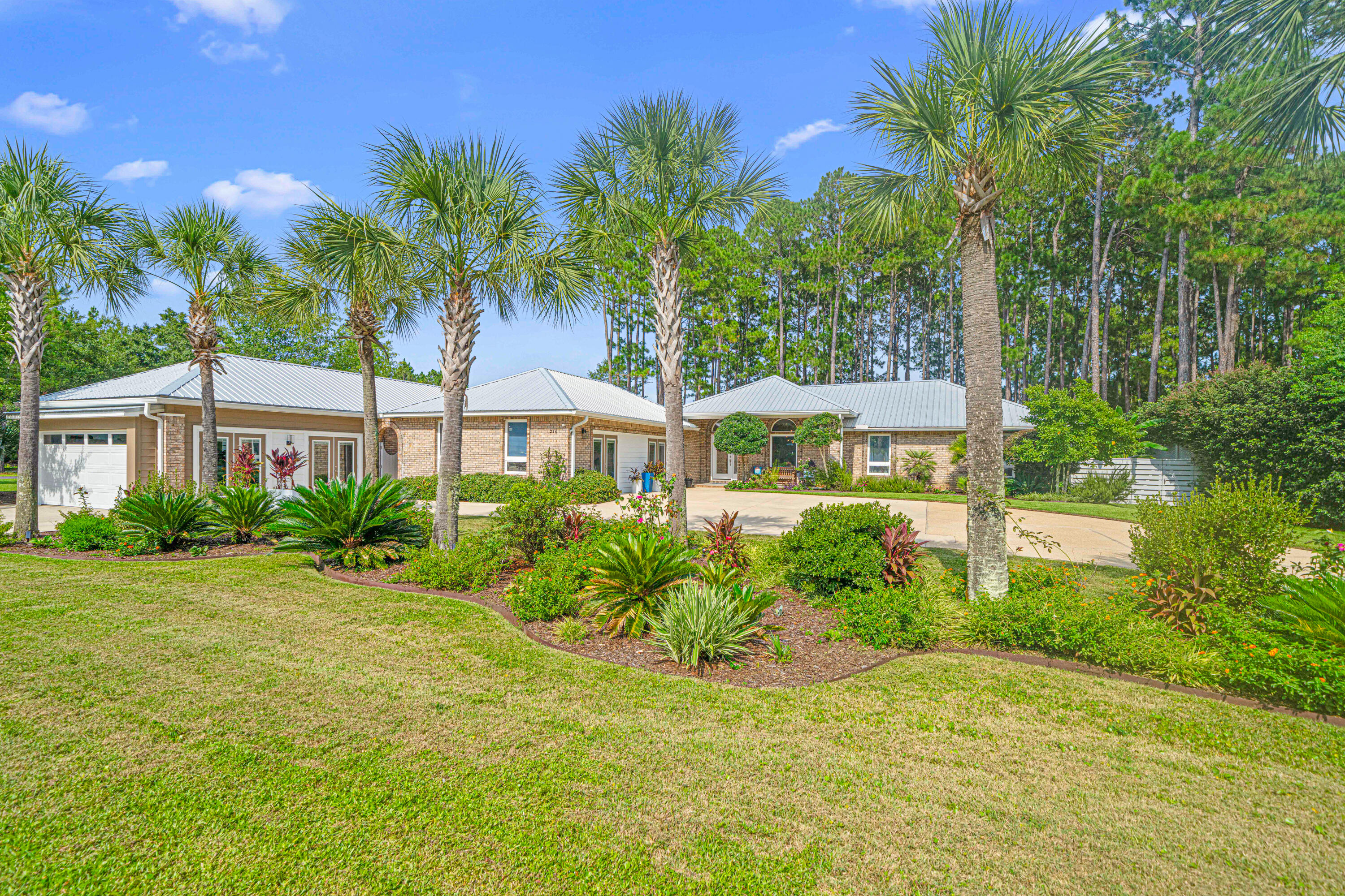 Rare Opportunity to own a unique property situated on lake Alicia in Santa Rosa Beach Florida! Great location 2 miles from the Gulf beach access and 2 miles from bay boat access. This is Essentially two homes on an approximately 3/4 acre lot. One carriage house consisting of 2 apartments- A one bedroom apartment (1 bedroom 1 bathroom) with private entrance and a studio apartment, also a 1 bedroom one bathroom with a two car garage with skylights and private entrance. The main residence, 3 bedrooms 2 bathrooms also has private entrance and plenty of parking, tons of natural light, east/west oriented with lake views throughout. Large outdoor covered porch complete with hot tub. All three separate living areas have been completely renovated, 3 kitchens and 3 laundry areas. More photos coming soon!
All on one level, no HOA, and not in a floodplain(zone x). The lot is something to see to appreciate. Beautifully landscaped with mature trees, gardens well groomed and irrigated. There is even a small pond with a fountain. A dock nestled along lake Alicia, complete with a powered shed and 4 vegetable gardens. Relax in the Hot tub on the 420 Sq.ft covered screened in patio, included in the sale. The newly built 2 car garage is equipped for an electric vehicle. All units have their own private fenced in area. New floors, new paint, new solid quartz countertops and backsplash, new toilets, custom built on site cabinets. This property has it all!