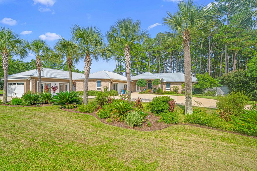 Rare Opportunity to own a unique property situated on lake Alicia in Santa Rosa Beach Florida! Great location 2 miles from the Gulf beach access and 2 miles from bay boat access. This is Essentially two homes on an approximately 3/4 acre lot. One carriage house consisting of 2 apartments- A one bedroom apartment (1 bedroom 1 bathroom) with private entrance and a studio apartment, also a 1 bedroom one bathroom with a two car garage with skylights and private entrance. The main residence, 3 bedrooms 2 bathrooms also has private entrance and plenty of parking, tons of natural light, east/west oriented with lake views throughout.  Large outdoor covered porch complete with hot tub. All three separate living areas have been completely renovated, 3 kitchens and 3 laundry areas. More photos coming soon!

All on one level, no HOA, and not in a floodplain(zone x). The lot is something to see to appreciate. Beautifully landscaped with mature trees, gardens well groomed and irrigated. There is even a small pond with a fountain. A dock nestled along lake Alicia, complete with a powered shed and 4 vegetable gardens. Relax in the Hot tub on the 420 Sq.ft covered screened in patio, included in the sale. The newly built 2 car garage is equipped for an electric vehicle. All units have their own private fenced in area. New floors, new paint, new solid quartz countertops and backsplash, new appliances, custom built on site cabinets. This property has it all! 