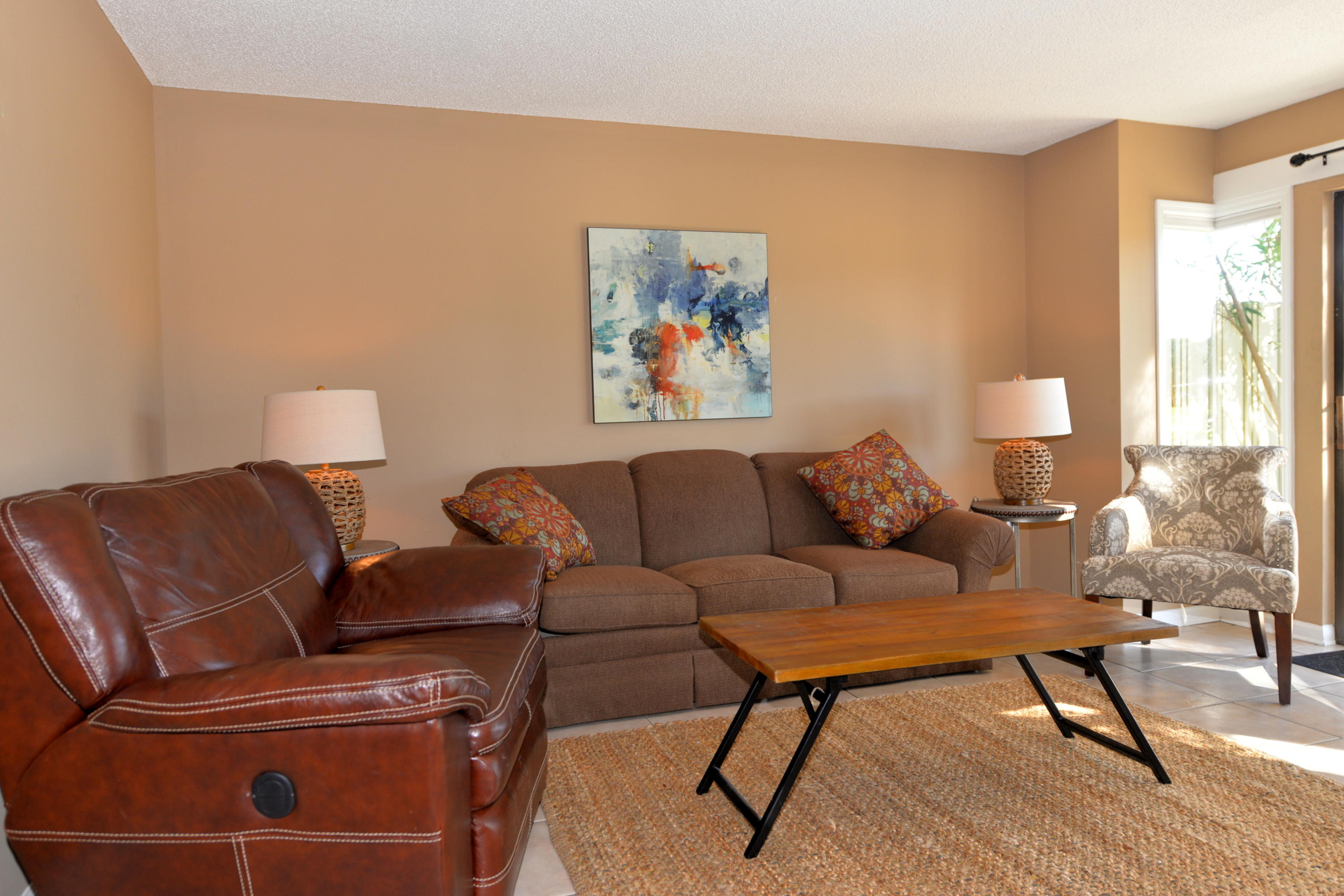 OWNER ANXIOUS! This attractive two bedroom, two & a half bath townhouse has a spacious deck which overlooks the beautiful Links golf course & a small lake. Both baths & the kitchen have been updated with pretty granite countertops. The unit also sports mostly new furniture, new linens, accessories, & light fixtures. Each of the two bedrooms has its own private bath & there is also a half bath downstairs. Floors on the first floor are all tile. Other amenities include a full-size washer & dryer, a patio, & a fenced area which houses the HVAC system & can also be used for exterior storage. Sandestin Golf & Beach Resort is a gated golf cart community. No need for a car...just zip over to the beach, Baytowne Wharf, or even Grand Boulevard. Sandestin amenities consist of 2400