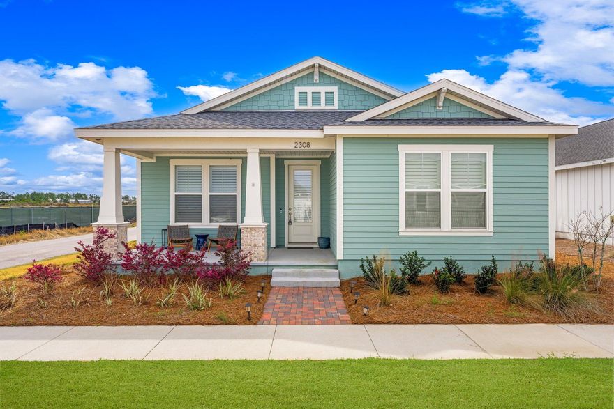 'CURRENTLY UNDER CONTRACT, SELLER WILL CONSIDER BACKUP OFFERS'  The Estero floor plan featuring a Boat Builder elevation, is one of the most popular Samuel Taylor home designs! Boasting 2,043 square feet of space, this residence within the vibrant SweetBay community offers a sprawling single-story layout, comprising 4 bedrooms and 2.5 baths. One bedroom is perfect for a home office. The expansive kitchen is adorned with stainless steel appliances, elegant granite countertops, and a tasteful backsplash. Step onto the covered front and back porch to relish in the serenity of SweetBay's surroundings. Furthermore, this home is meticulously appointed with custom-EF San Juan designed inset kitchen cabinets reaching the ceiling, accentuating an island cabinetry with a distinct hue.