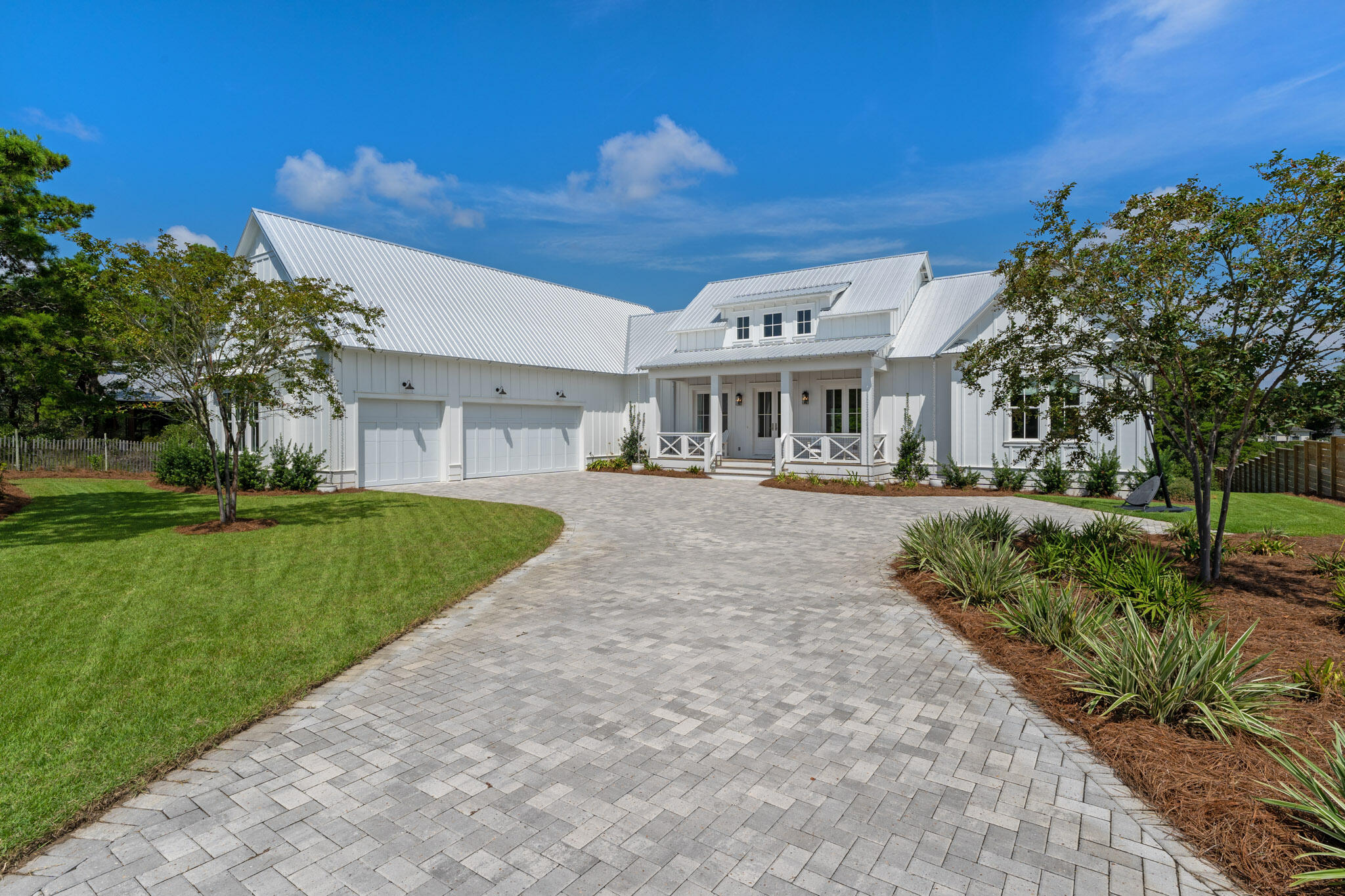 Classic southern style meets coastal contemporary chic in this custom-built home on a very rare half acre parcel, conveniently located in Blue Mountain Beach.