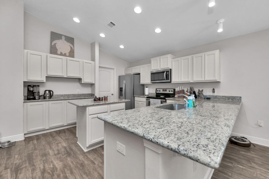 Looking for a home that is move in ready? This is it! Open floor plan with luxury vinyl plank floors. The kitchen features granite countertops, stainless steel appliances, island, coffee bar and long breakfast bar. Walk-through pantry with plenty of shelves leads into the laundry room. The dining area has french doors that overlook the backyard. Spacious Master suite with a trey ceiling and ceiling fan. Master bathroom  double vanity, garden tub with separate shower and a large walk in closet. Fully fenced in backyard. This home is centrally located in Pace. Minutes from I-10, Highway 90,Super Walmart, Lowes, restaurants & shopping. About fifteen minutes to NAS Whiting Field and UWF. Call today to schedule a private showing.