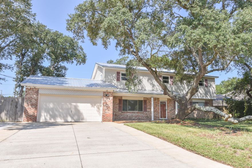 MOVE-IN READY 4 bedroom 2.5 bath home with pool for only $489,900! Very clean with new metal roof in 2019. Large parking pad for boat or RV with gate to side street. Centrally located in Fort Walton Beach and nearby schools, shopping, restaurants, and more. Home was recently remodeled including: new kitchen & baths, granite countertops, stainless appliances, new LVP & tile floors throughout, new interior doors & trim, Rinnai tankless instant hot water heater, gas fireplace in living room, private fenced backyard, screened in pool w/ hot tub, and no HOA fees.