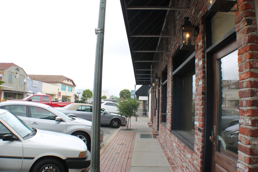 Main Street Crestview! Down town historic district. This would make a great professional office, retail, or restaurant! Bring your charming antique vision to life on Main Street!