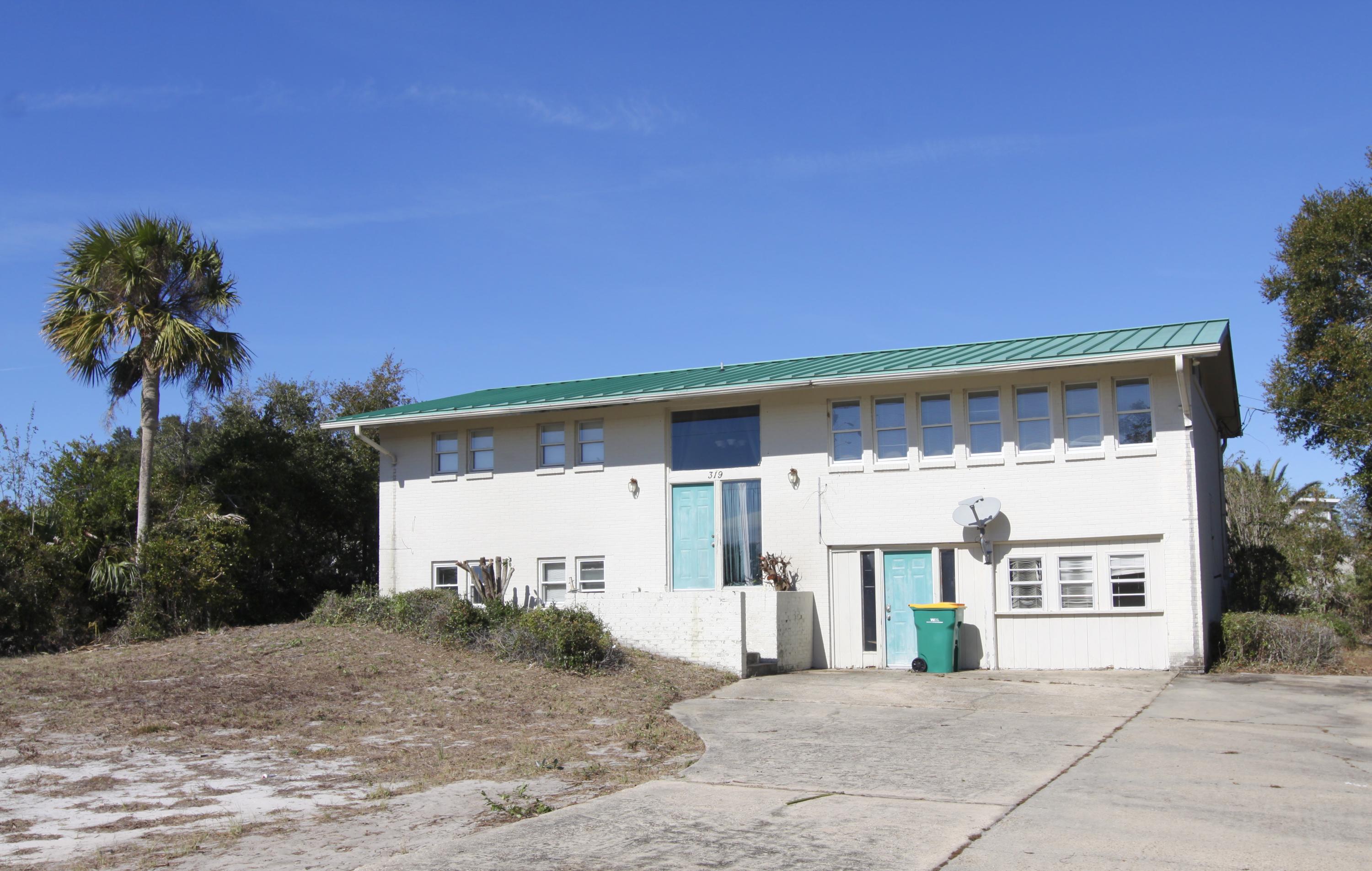 REDUCED! 3074sf freestanding office building in Destin's Commercial Trades & Services sector. This brick building has a standing seam metal roof and is laid out with multiple rooms for a wide verity of uses. The corner property is .46 acres with access from Mountain Drive and Pelican Place.