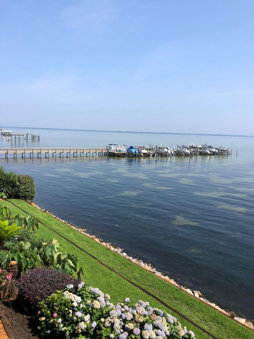 Million $$ View! Enjoy waterfront living at its best in this second level condo with 10' ceilings that has amazing views, spectacular sunrises and sunsets over the Chocatahachee Bay, dolphins at play, and fishing off the dock. This unit comes with a boat lift in a 20' slip, the dock is HOA-owned. Oak Harbour is located near the Destin Airport, Shopping, Restaurants, and all that the Destin lifestyle has to offer. Don't miss this opportunity to own a waterfront Bay unit. With only 12 units in this non-rental building, they rarely come available and don't last long. Perfect for those wanting to downsize or use as a 2nd home. There is one covered parking space in front of the unit. All dimensions are approximate and must be verified by buyer. Interior photos coming soon.