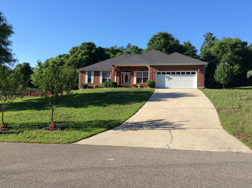 Indian Trails PH 3, featuring Two fully stocked PRIVATE fishing lakes and community PARK for you to enjoy! This lovely well maintained and move in ready brick home home features 3 bedrooms plus an office/nursery/bonus room. Located on a HUGE .45 Acre Lot with a TREEHOUSE and kids play structure! The picturesque lot features pear, plum, and lemon trees, blueberry and blackberry bushes, a garden space, and is located just across the street from the lake. There is even a built in pet area and invisible pet fence! The interior features a spacious split bedroom layout and open floor plan with tall ceilings, upgraded laminate wood flooring, corner fireplace, large living room, recessed lighting, formal dining room with double tray ceiling, and oversized arched transom windows