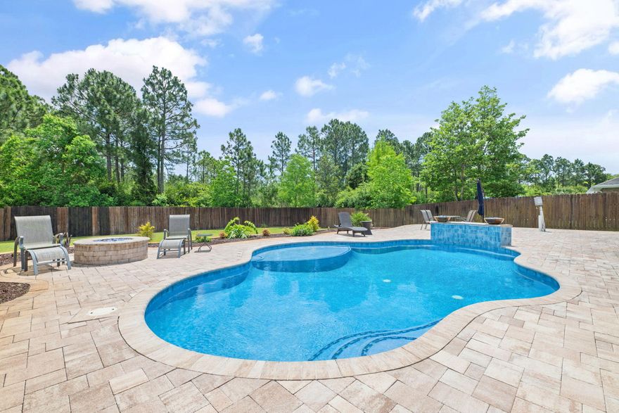 Nestled in a charming neighborhood, this stunning four-bedroom, three-bathroom luxury home offers the epitome of modern living. As you step through the grand entrance, you're greeted by an open-concept floor plan bathed in natural light, highlighting the exquisite finishes and attention to detail throughout. The gourmet kitchen, equipped with top-of-the-line appliances and a spacious island, is perfect for both casual meals and entertaining. The elegant living and dining areas flow seamlessly to the outdoor oasis, where a sparkling pool awaits, surrounded by lush landscaping and ample lounging space. Retreat to the master suite, a sanctuary of tranquility, featuring a spa-inspired bathroom and generous walk-in closet.