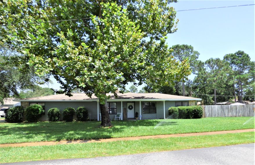 Move-in ready 3 bedroom, 2 bath well maintained home LIVES LARGE.  Don't let the square footage keep you from looking at this one... great features: situated on large corner lot, front porch, semi-open floor plan makes the home feel larger, vaulted ceiling, fireplace, updated kitchen with granite counter tops, attractive backsplash, stainless steel appliances, pantry, sliding hi impact doors lead to wood deck - great for grilling and relaxing, laminate floors in living, dining, kitchen, hallways, carpet in the bedrooms, spacious bedrooms, skylight in guest bath, extra-large side entry garage (lots of storage), fenced in backyard with double side gate on one side and single gate on another side, sprinkler system and well pump.  Home warranty provided, and the termite bond with Bryan Pest