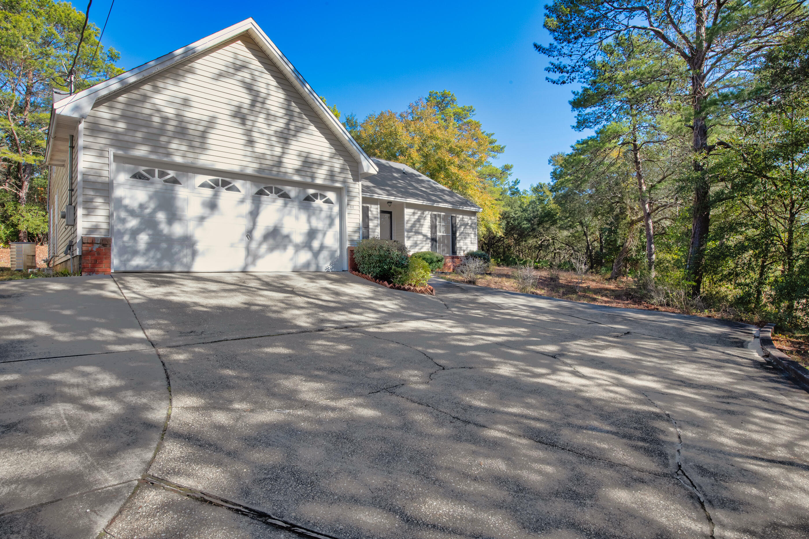 New Roof with a full priced offer!This stunning 4-bedroom, 2.5-bath home in the heart of Niceville offers both style and functionality for modern living. The main level features an inviting open living and dining area with soaring tall ceilings, creating a bright and airy atmosphere perfect for family gatherings and entertaining. Downstairs, you'll find three spacious bedrooms, including a primary suite with a walk-in closet and en-suite bath for ultimate privacy and comfort. Upstairs, discover a versatile bonus space that can be customized to suit your needs, along with the fourth bedroom, providing extra space for guests, a home office, or a game area. Outside, the large backyard offers endless possibilities for outdoor enjoyment. Centrally located in Niceville, this home is just minutes from top-rated schools, parks, shopping, and dining, offering both convenience and comfort in a vibrant community.