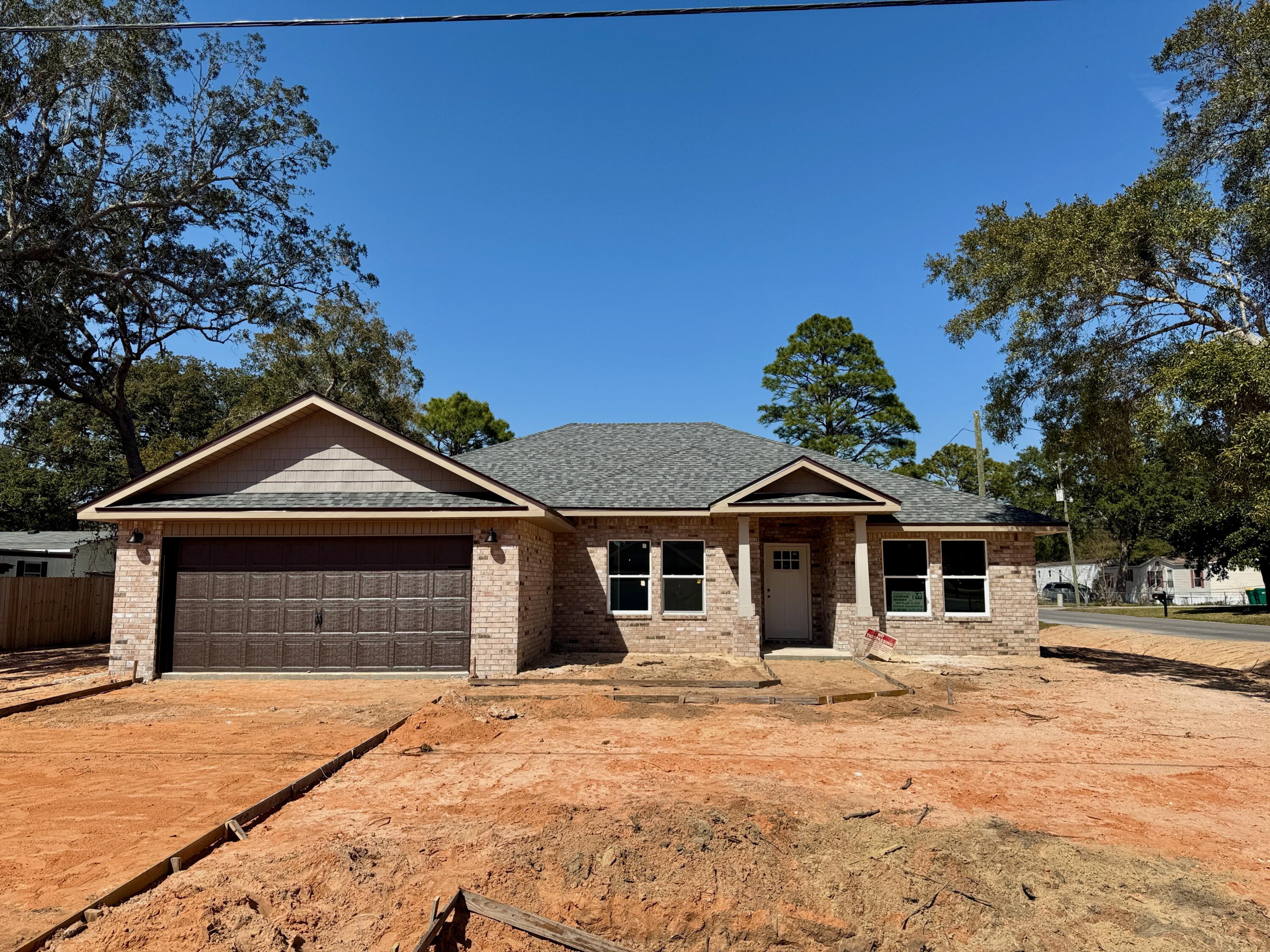 BRAND NEW BEAUTIFUL ALL BRICK COTTAGE STYLE HOME ON CORNER LOT. NO HOA! NO CARPET!A COVERED FRONT PORCH & STATELY COLUMNS WELCOMES YOU IN!KEY FEATURES: KITCHEN: Upgraded Quartz counters, Gray shaker style wall cabinets & large complimenting white island bar cabinet w/deco accents, tiled back splash, pendant lights, soft close drawers, SS appliances. Spacious walk-in pantry. LIVING ROOM: Airy & open to kitchen w/ recessed ceiling, crown molding, LED puck lights, Ceiling fan & french doors to covered back patio.MASTER BR: Trey ceilings, crown, puck LED lights, ceiling fan. MASTER BATH: Upgraded Quartz counters, dual sinks, Lg beautiful custom tiled shower w/seamless glass door & dbl shelved walk-in closet. PLUS: PREMIUM LVP floors throughout including Office & Bedrooms. Covered rear patio, Ceiling fans w/light throughout, Hurricane Fabric protection, Pull down attic ladder, Architectural Shingles, 5-1/4'' Baseboards, Crown in 10 ft. areas, Spacious rear & side yards with privacy fences & gate, Wall cabinets and closet in Laundry, HVAC unit has UV light sanitizer system, Hall linen closet, Roomy guest bath has Quartz counter, shower/tub combo & linen closet, Double car garage w/auto opener, Flat textured ceilings, Low-E Windows, Sprinkler System, Local Builder & One year Builder Warranty.
Low Insurance Quote! Almost ready!
This is a Gorgeous Home and only short drive to beaches, AF Bases & shopping/dining.
Call today for your tour!
