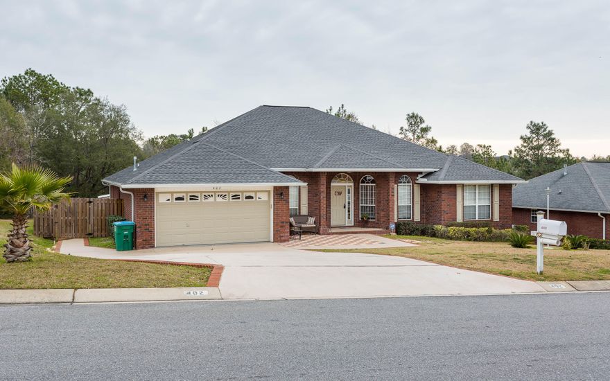 Who needs the beach, when you have paradise in your back yard? Exceptional 4 Bedroom 3 Bathroom home in South Crestview with a pool. From the moment you drive into the driveway you can see the attention to detail on this home. A brick lined walkway leads you into your oasis. As you enter the foyer you will find a formal dining to your left and office to the right. Upgraded wood patterned tile flooring and a custom stone fireplace are sure to please. The eat-in kitchen boast upgraded cabinetry, granite, mosaic tile backsplash and stainless steel appliances. This master suite is large enough for your king sized furniture, has his and hers walk in closets, large soaker tub, separate shower and double vanity. In addition to the master, this split floorplan home has the three spacious bedrooms