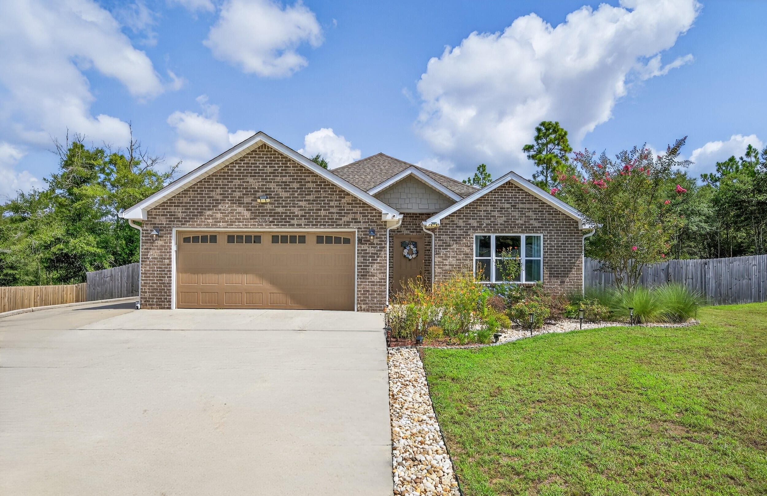 Welcome to Magnolia Oaks! This charming home, built in 2018, is located on the north end of Crestview and has no HOA! Inside, you'll find LVP flooring throughout the living areas and cozy carpeting in the bedrooms. The kitchen features granite countertops, a tile backsplash, and an island for extra seating, along with custom molding around the doors and gutters on exterior. This home offers numerous upgrades, including enhanced insulation for improved energy efficiency, with Chelco as the power provider. Recently added Levitron Decora rocker switches and upgraded lighting and ceiling fans can be found throughout. The extra-wide paved driveway is ideal for RV or boat parking, while a privacy fence with 6-foot and 8-foot provides added privacy, complete w/ 3 gate doors. Set on .53 acres, there's plenty of room for a pool, and the sellers have created a smaller fenced area perfect for dogs. The garage features epoxy-painted flooring and extra storage cabinets. Electric vehicle owners will appreciate the dual 220-volt outlets for charging. Recent updates include a new refrigerator, dishwasher, fresh paint, updated cabinet hardware, and under-cabinet LED lights with motion sensors added in 2021.The primary suite boasts dual walk-in closets with shelving, and all ceiling fans have been upgraded to remote-controlled LED models. The washer and dryer will convey in AS-IS condition, along with a wash basin in the laundry room. Enjoy the spacious covered patio leading to a newly painted concrete area. The backyard has a custom shed with a metal roof and a rain collection system for gardening, plus gutters with leaf guards for easy water collection. Chicken coop to accommodate up to 8 chickens. This home is filled with upgrades and ready for its new owners! Call today to schedule your appointment! All measurements to be verified by buyer