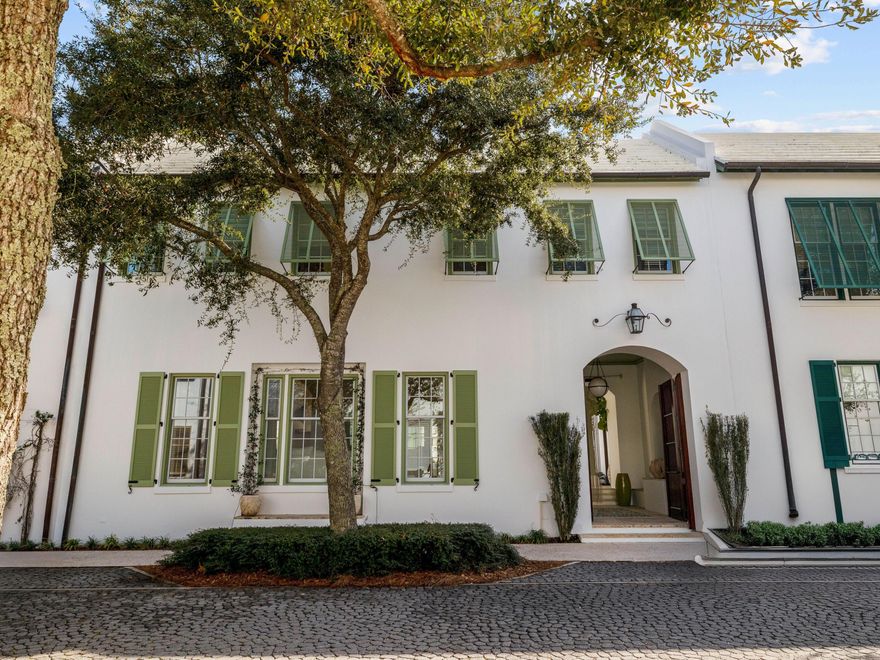 Enviably located in the heart of Alys Beach, this architectural masterpiece combines elegant sophistication with peace and privacy. Designed by architect Steve Mouzon, it has a central courtyard around which all the other rooms are arranged. It creates an exceptional private sanctuary for the ultimate indoor-outdoor lifestyle. A glass door opens into the eat-in kitchen and spacious open floor plan with cool Dominican stone flooring creating a neutral base. Culinary enthusiasts will appreciate the gourmet kitchen with high-end Thermador appliances and custom cabinets featuring extraordinary red gum hardwood. One area houses a dedicated coffee station. An expansive island has limestone counters and three stools for cocktails or snacks. The formal dining table easily seats six beneath a vaulted 12-foot ceiling supporting a sparkling chandelier. After dinner, relax in the spacious sitting room, where chairs are grouped for conversation around the fireplace. Multiple windows introduce natural daylight and views of the quiet street outside. Head upstairs to find a landing with an office or reading nook overlooking courtyard views. Two beautiful guest suites have polished pecky cypress flooring, ample closets/dressing rooms, and luxury private bathrooms, each with an earthen stone vanity. The master suite is in an entirely separate wing with its own private access from the courtyard. Beautifully architected, it displays elegant arches, mosaic tile wall features and a two-way gas fireplace warming both the bedroom and bathroom. Stone tiles, pebble insets and twin vanities with vessel sinks reinforce a sense of nature. Lie back in the stunning garden tub and enjoy moments of bubbly bliss in this spa-like haven. French doors open into the courtyard, where a tinkling water spout creates a pleasing backdrop. The outdoor shower is the perfect place to rinse sandy feet after a swim or stroll on the nearby beach. An outdoor kitchen provides everything you need for alfresco dining and lounging on cushioned seats in sunshine or shade. The home has new A/C, fresh exterior paintwork, custom lighting, new furnishings and off-street parking for two vehicles. Beyond this private enclave, a host of activities beckon, including the owners' private beach club and the serene Caliza pool for swimming, lounging and dining. Zuma Wellness Center is fully equipped for a workout and massage. Multiple parks and green spaces provide pleasing areas to ramble or you can hop on your bike and explore the restaurants, shopping and entertainment on offer along Scenic Highway 30A.