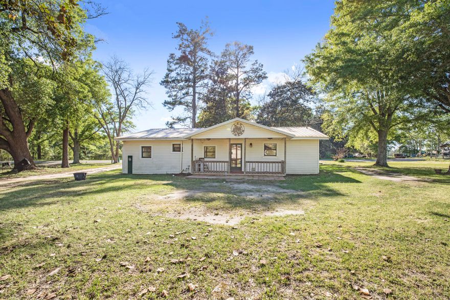 BACK ON MARKET AT NO FAULT OF THE SELLER! Country life, country charm, and serenity are plentiful as you drive up at this well maintained home! The quietness of the country lifestyle plus having over an acre allows your family to enjoy the time seemingly slowing down. Enough room to enjoy any and all activities desired. As you enter the front door by way of the covered porch, you are greeted by a cozy living room featuring an electric fireplace featuring real wood mantle , crown molding, and a picture frame ceiling using hand stained wood and beadboard. Enjoy the morning sunrise or evening breeze on the back or front porch with a coffee or favorite beverage along with your important people.  The living room opens up to the spacious kitchen and dining room featuring tile flooring,