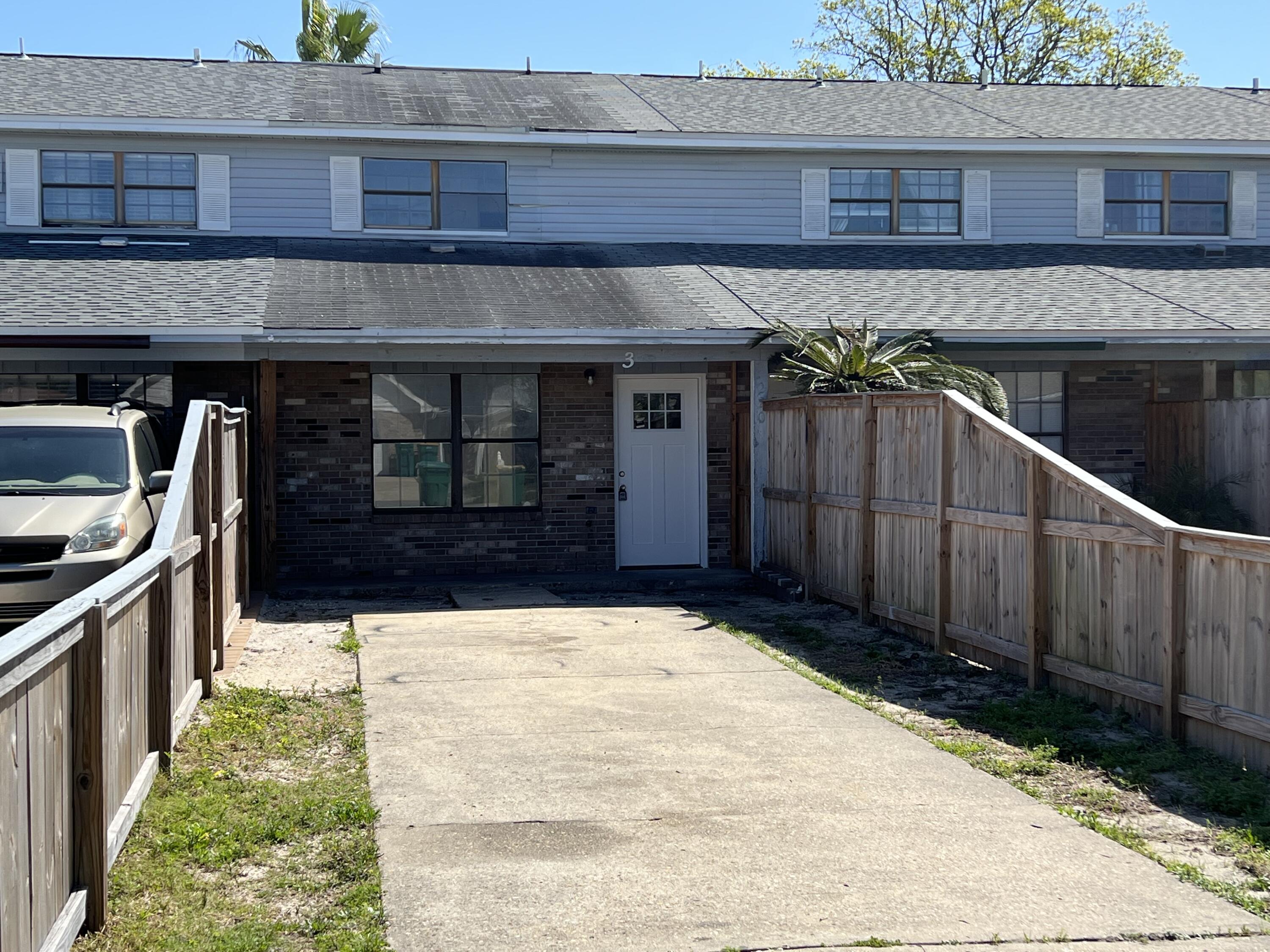 Great investment opportunity in the heart of Destin. NO HOA! 3 beds, 2 full baths. 1 bed and bath downstairs! Fenced in back patio with storage room. Needs kitchen cabinets, vanities,flooring and roof. Shopping, school and the beautiful white sand beaches are just minutes away. Property is being SOLD AS IS. Buyer to verify all pertinent information including sq. footage and lot dimensions.