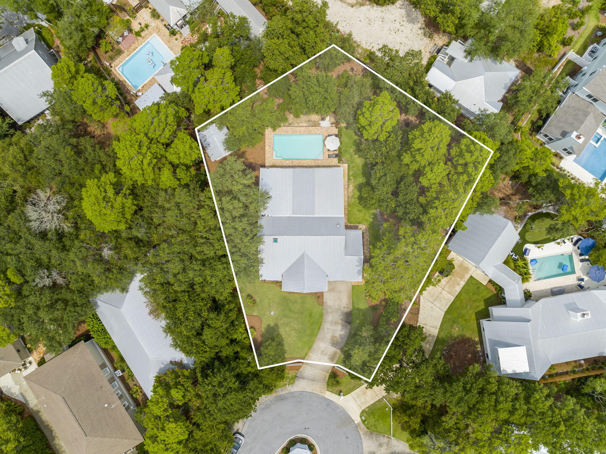 Welcome to 279 Seabreeze Court, a standout property on 30A. This rare single-level home offers 2,075 square feet of thoughtful design and practical luxury. Located on a private cul-de-sac, this 4-bedroom, 3-bathroom home boasts a spacious lot and an inviting backyard with a large pool--ideal for relaxation and entertaining. There's also room to potentially add a garage or expansion to the front or side of the house, if desired.The open living area seamlessly connects the kitchen, dining, and living spaces, creating a cohesive and welcoming environment. The kitchen island features a striking black custom countertop, and folding glass doors open to the backyard, blending indoor and outdoor living effortlessly. An adjacent office space offers convenience for those working from home.

The primary bedroom provides a peaceful retreat with views of the expansive yard. Additional bedrooms are designed for comfort, making this home perfect for families or guests. A storage building adds practical utility, ensuring ample space for your belongings.

This property also includes deeded and gated beach access. The non rental status maintains the serene, residential feel of the neighborhood.

279 Seabreeze Court combines luxury and functionality with potential for further customization. Don't miss this opportunity to own a unique and desirable home on 30A.