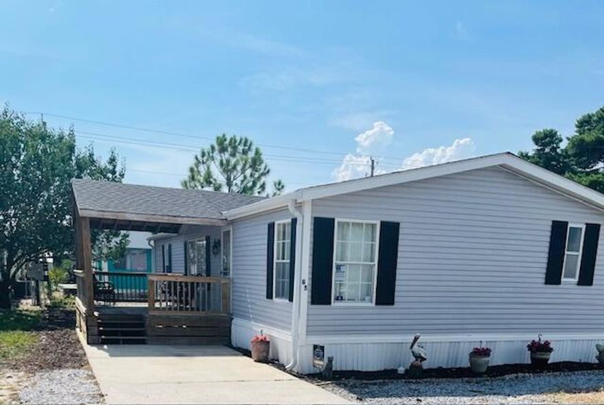 PRICED TO SELL! Furnished 3BR/2BA Home in Gated 55+ Community - Prime Miramar Beach Location!Don't miss this opportunity to own a fully furnished 52 ft, 3-bedroom, 2-bath mobile home in the sought-after Destin East Mobile Home Park--an exclusive, gated 55+ owner-occupied community where leasing is not permitted, ensuring a quiet and well-maintained environment.This spacious home features a large living area, a bright kitchen with a pass-through bar, a dedicated dining area, and a walk-in laundry room. The master suite is oversized, plus there are 2 spacious secondary bedrooms. Ideally located in the heart of Miramar Beach, this home is just minutes from the area's world-famous white-sand beaches and crystal-clear waters.