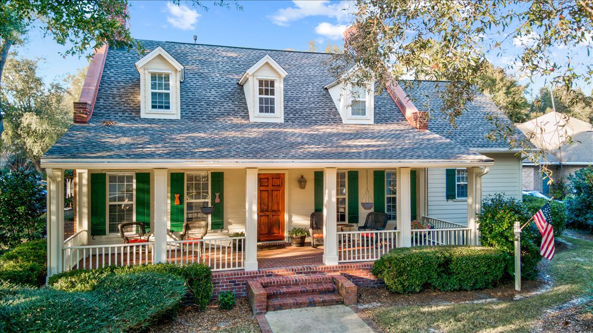 Located on a large corner lot in the coveted Swift Creek section of Niceville, this charming Southern Cottage boasts a spacious and welcoming front porch overlooking a professionally landscaped yard boasting mature shade trees and new (2019) Zoysia sod lawn. The lovely exterior of brick and Hardy Board siding has been treated with RhinoShield sealant for added protection, and the windows are equipped with Lookout Shutters Inc Clear storm panels. A new roof, installed in 2018, completes the classic facade.The interior of this 2 story, 3 bedroom, 3 1/2 bath home has been updated with 2 new HVAC units, including all new duct work, in 2018. Wood floors and crown molding throughout enhance the warm, welcoming ambiance of the home which includes a large, well appointed first floor master bedroom with ensuite bath. The 2nd level consists of 2 large , additional bedrooms with baths and a roomy rec/bonus room. The chef's kitchen is equipped with recessed lighting, granite countertops, farmhouse sink, a gas stovetop, and updated stainless steel appliances including new dishwasher, refrigerator and double wall ovens. The home has plenty of storage throughout, including a climate controlled 300 sq. ft. attic conversion that could be easily converted to a bonus room by just adding drywall.
The backyard is outfitted with a fiberglass, salt water pool with a 25 year warranty surrounded by a brick and paver pool deck. The pool is encased in a Super Screen enclosure with a 10 year warranty.
The Swift Creek division offers many community amenities, including quiet, sidewalk lined streets, a community pool and clubhouse, gazebo and family picnic area, tennis and basketball courts, and nature hiking/biking trails.
A perfect spot for entertaining friends and family, this charming home has too many features to list here and must be seen to be fully appreciated.