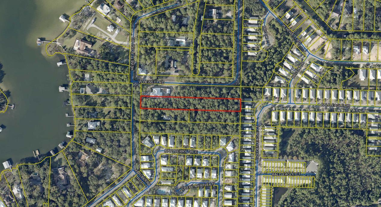 Discover a large exceptional building lot located on West Hewett Road, north of Highway 98, in the highly sought-after area near Choctawhatchee Bay and Sandestin. This spacious lot offers a prime opportunity to create your dream home or investment property in a serene and picturesque setting.The lot boasts a generous 1.34 wooded acres with ample room for construction, while providing easy access to the beautiful beaches of 30a & Destin and the vibrant community of Sandestin. Enjoy nearby recreational activities, including boating, fishing, and golfing, as well as an array of dining and shopping options.With its convenient location and potential for bay views, this property is perfect for those looking to embrace the coastal lifestyle.