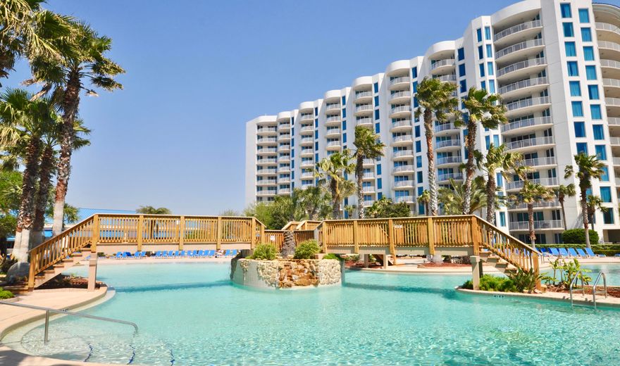 Fantastic views of the gulf. Upgrades throughout, including Armstrong lighting, Lovelace Interiors furniture, crown molding, a new backsplash, upgraded washer and dryer and this condo is still under a home warranty. The amenities include a work out facility, lagoon style pool, property has covered parking, security, tennis courts, a basketball court, playground and shuttle service to the beach Emerald Grande and Destin Commons. The onsite pizza pub can be delivered to your room and they even have a full service Spa on the grounds. This is such a well laid out floor plan. Whether you are planning to rent or live here, this is one you won't want to miss, it has been a primary residence and shows so well. This is in the west building with views of the gulf.